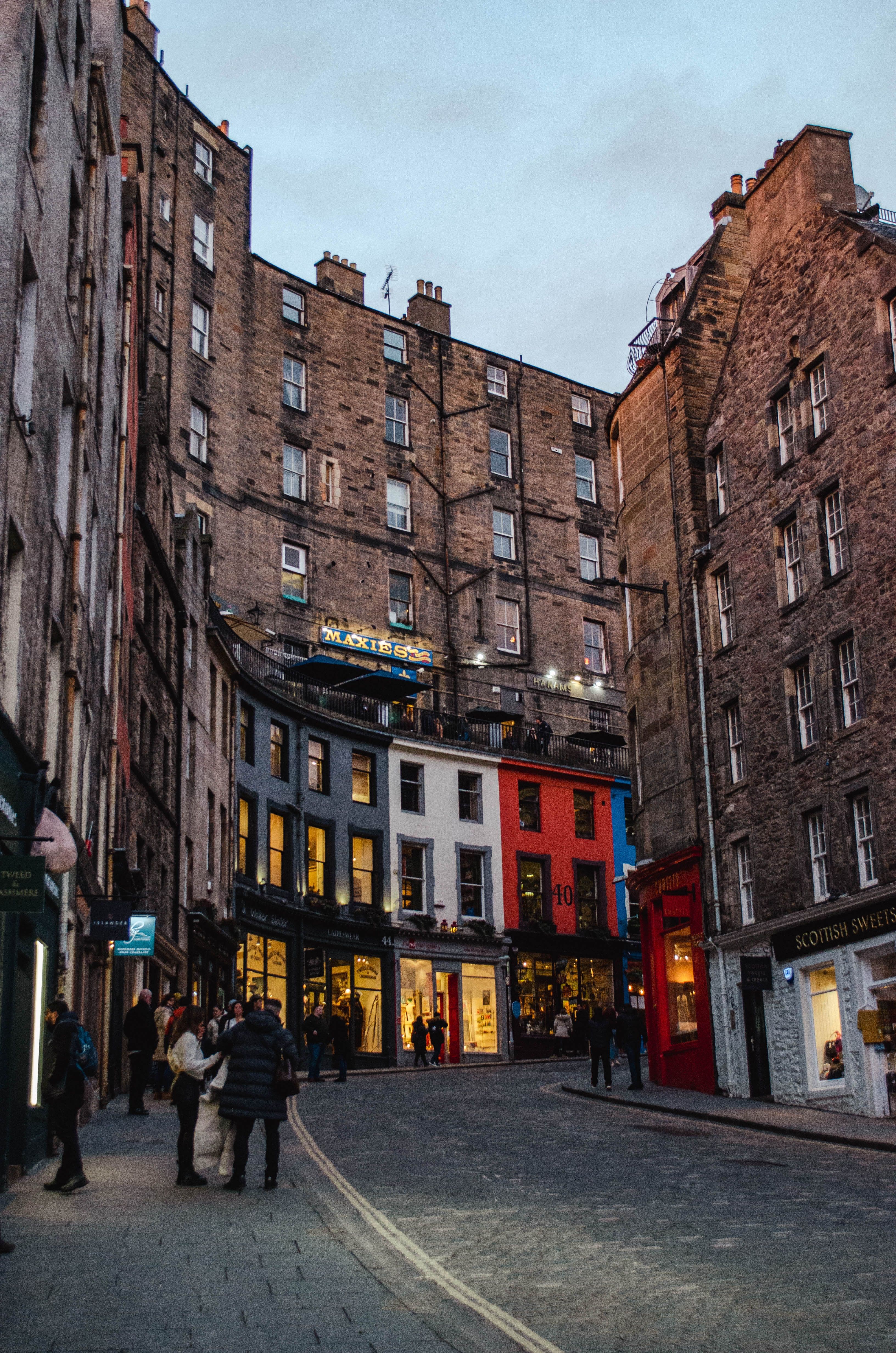 Victoria Street in Edinburgh's Old Town, its curved row of colourful shopfronts near the Grassmarket, close to the marathon's opening miles
