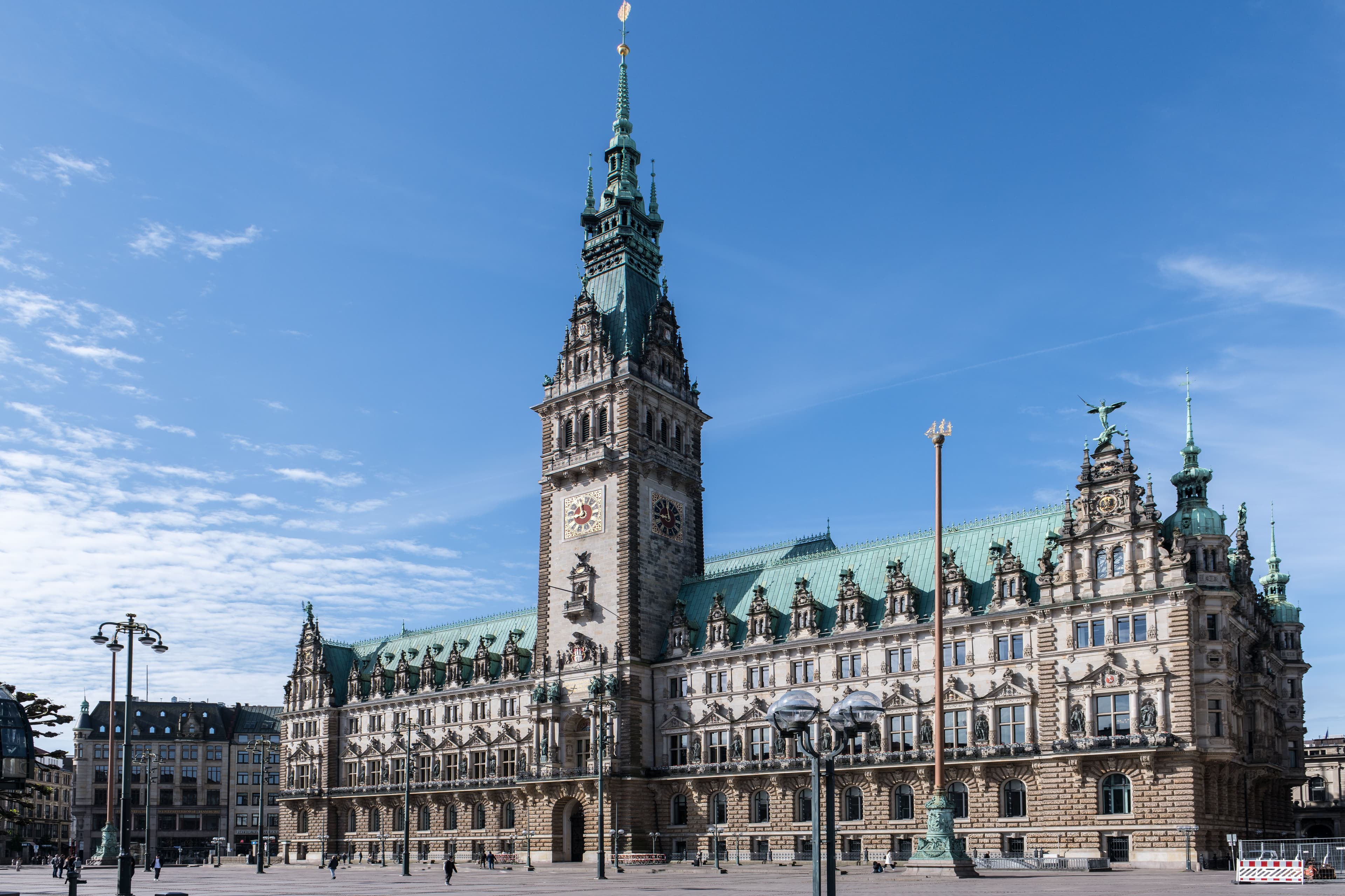 Hamburg's Rathaus (city hall) on Rathausmarkt under a clear blue sky