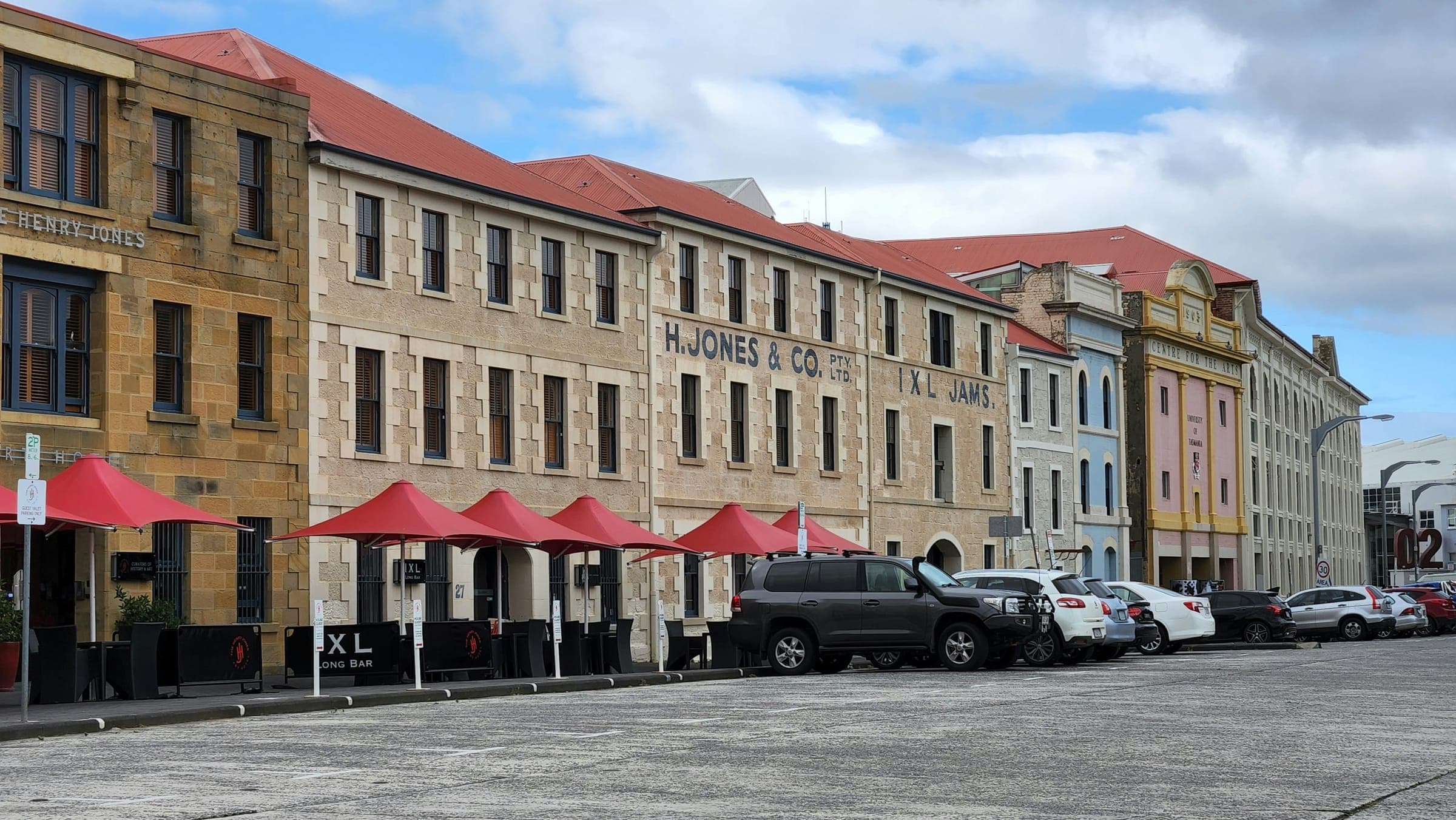 The sandstone IXL jam-factory warehouses on Hunter Street, Hobart, now the Henry Jones Art Hotel, beside the Sullivans Cove waterfront that the Hobart Marathon passes four times