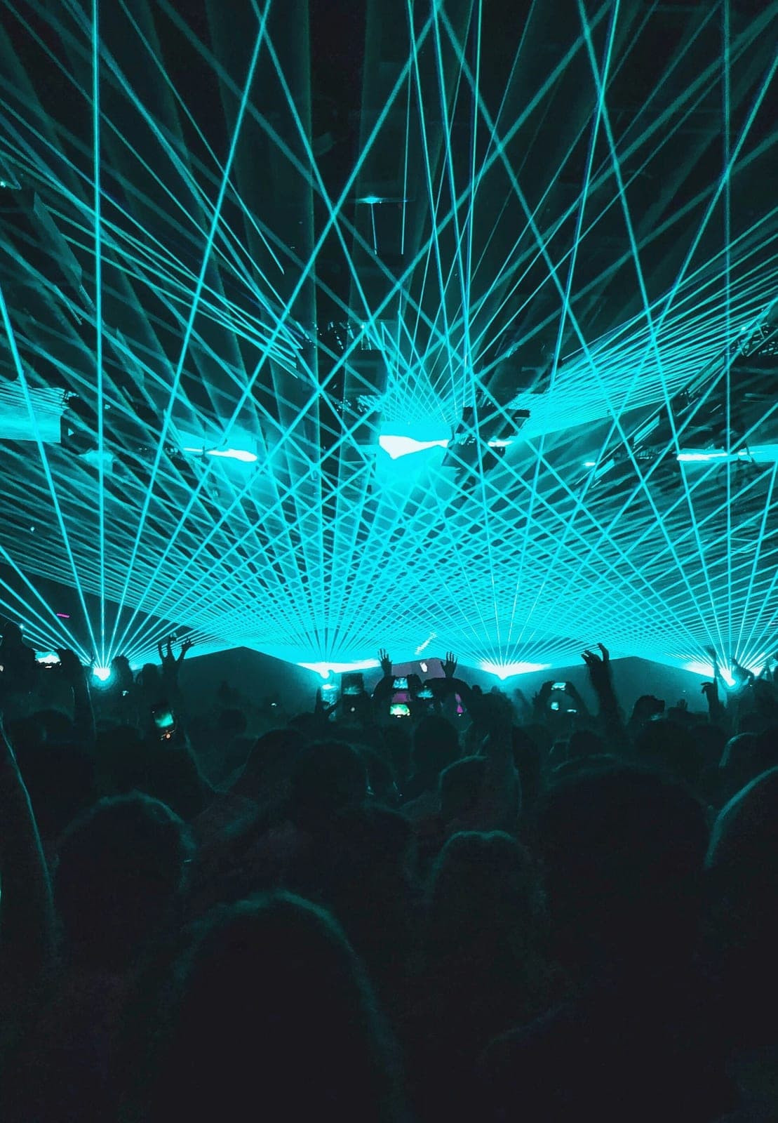 Green lasers above a packed dance floor in an Ibiza club, the island’s nightlife, mostly quiet in April