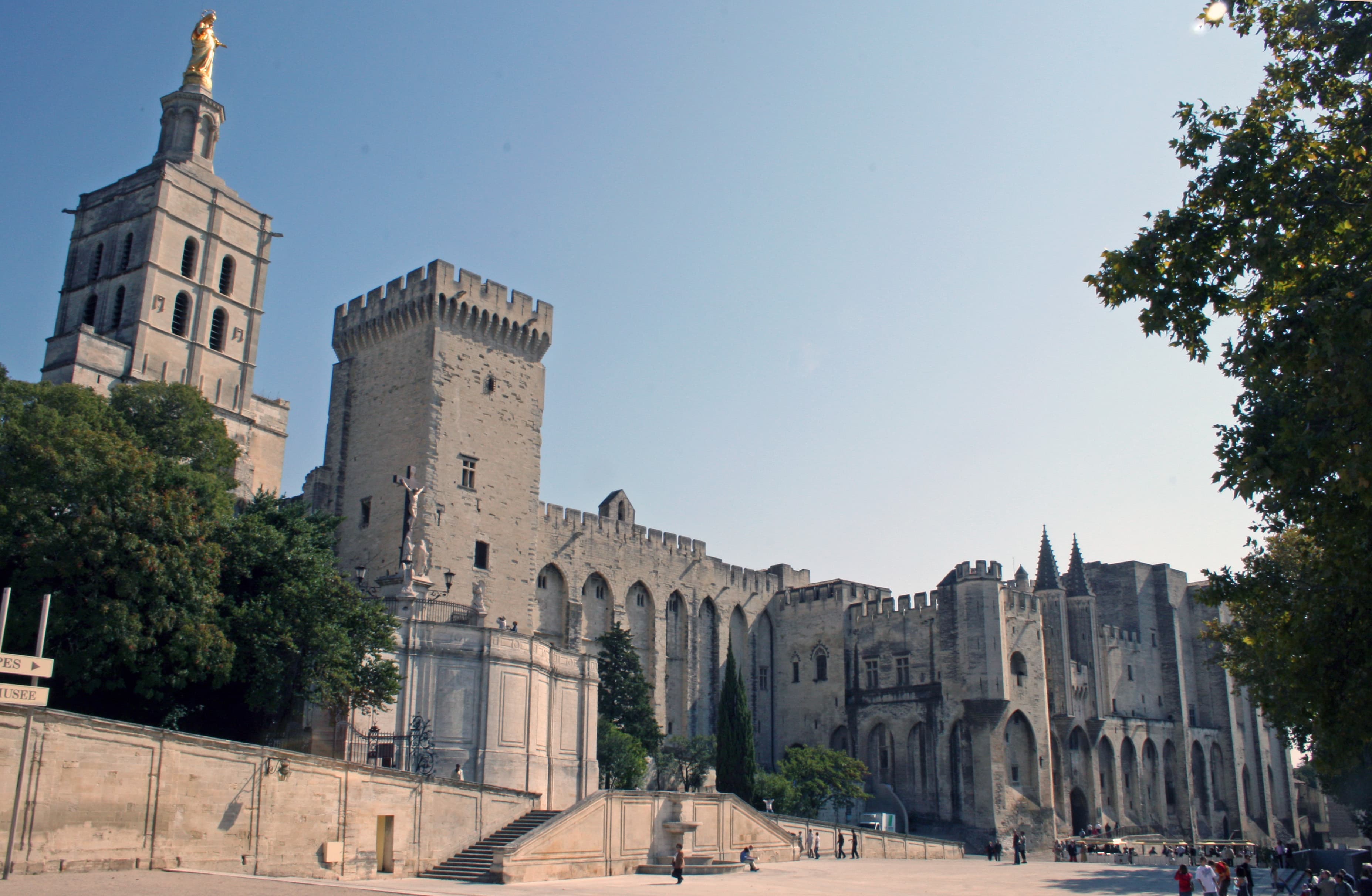 The Palais des Papes and Avignon Cathedral rising above Place du Palais, the enormous Gothic fortress-palace that dominates the walled city of Avignon, Provence