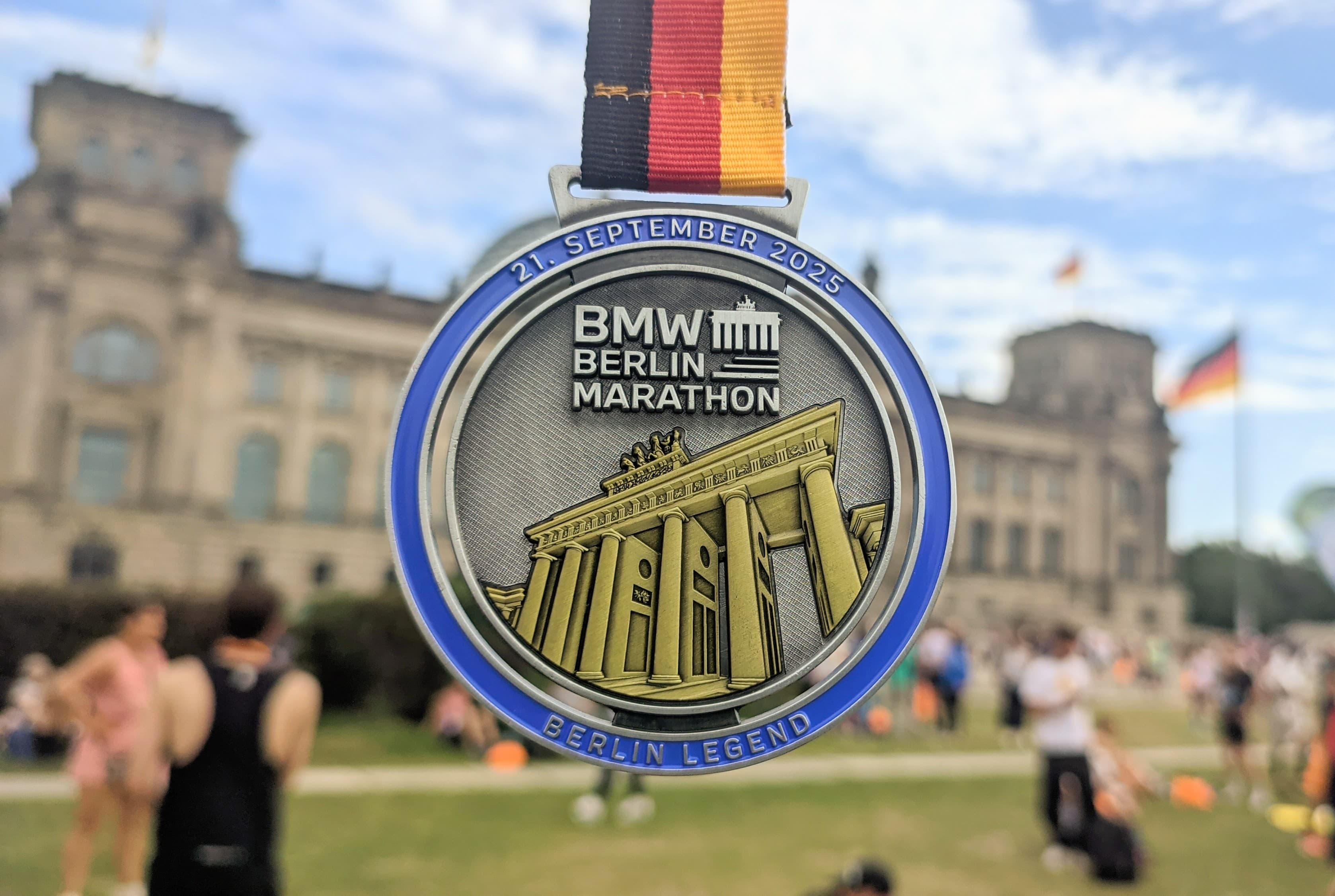 2025 BMW Berlin Marathon finisher medal in front of the Reichstag, Berlin