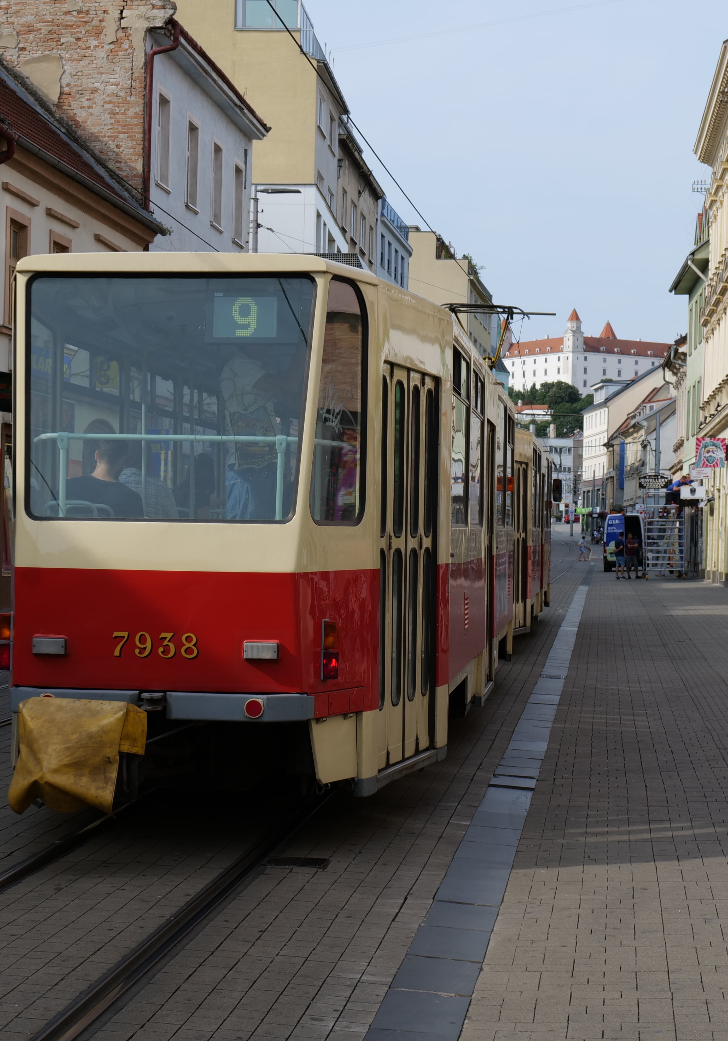 A Bratislava tram on route 9 with Bratislava Castle visible in the background
