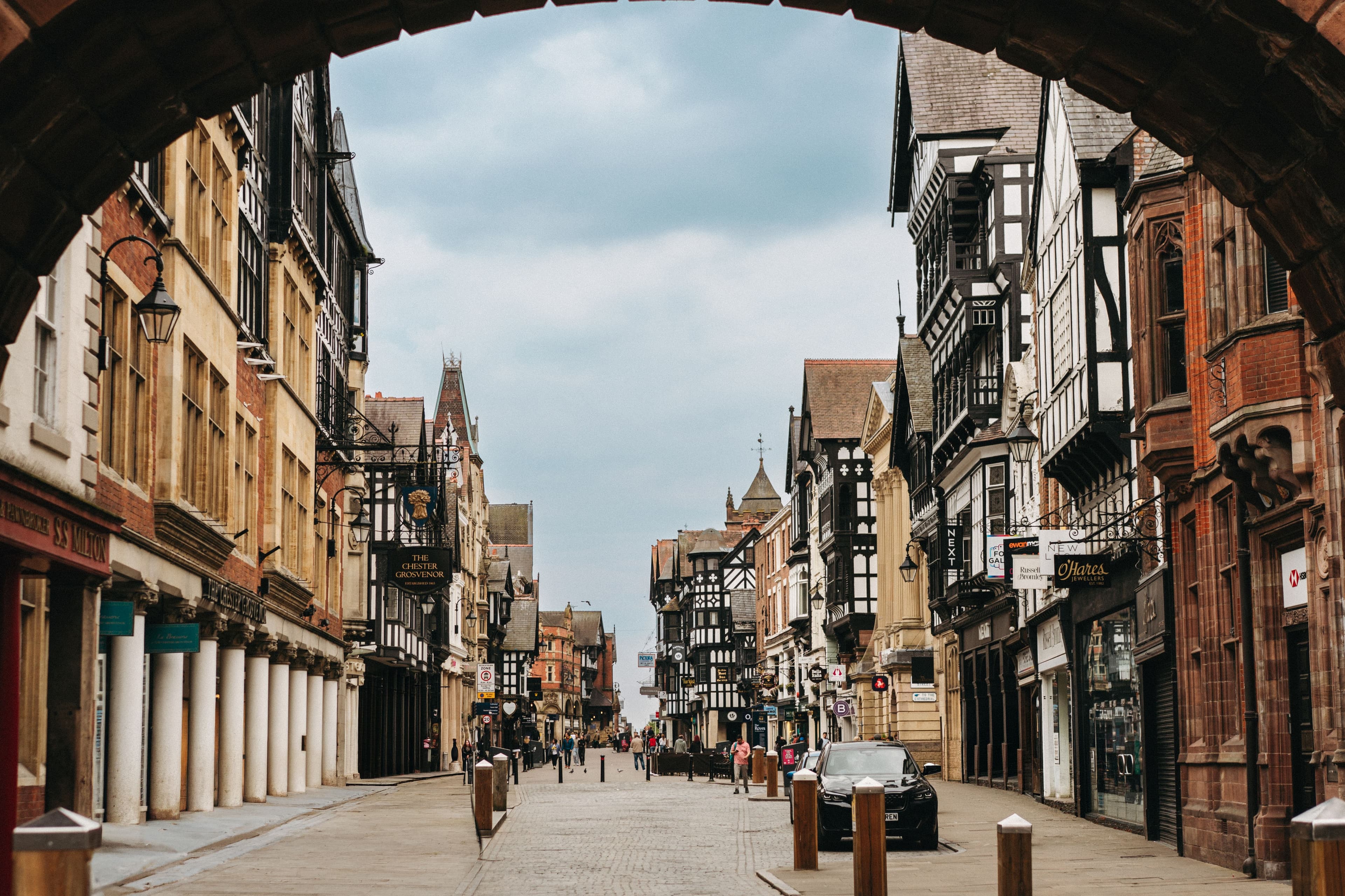 View through the Eastgate Clock arch down Chester's black-and-white timber-framed high street