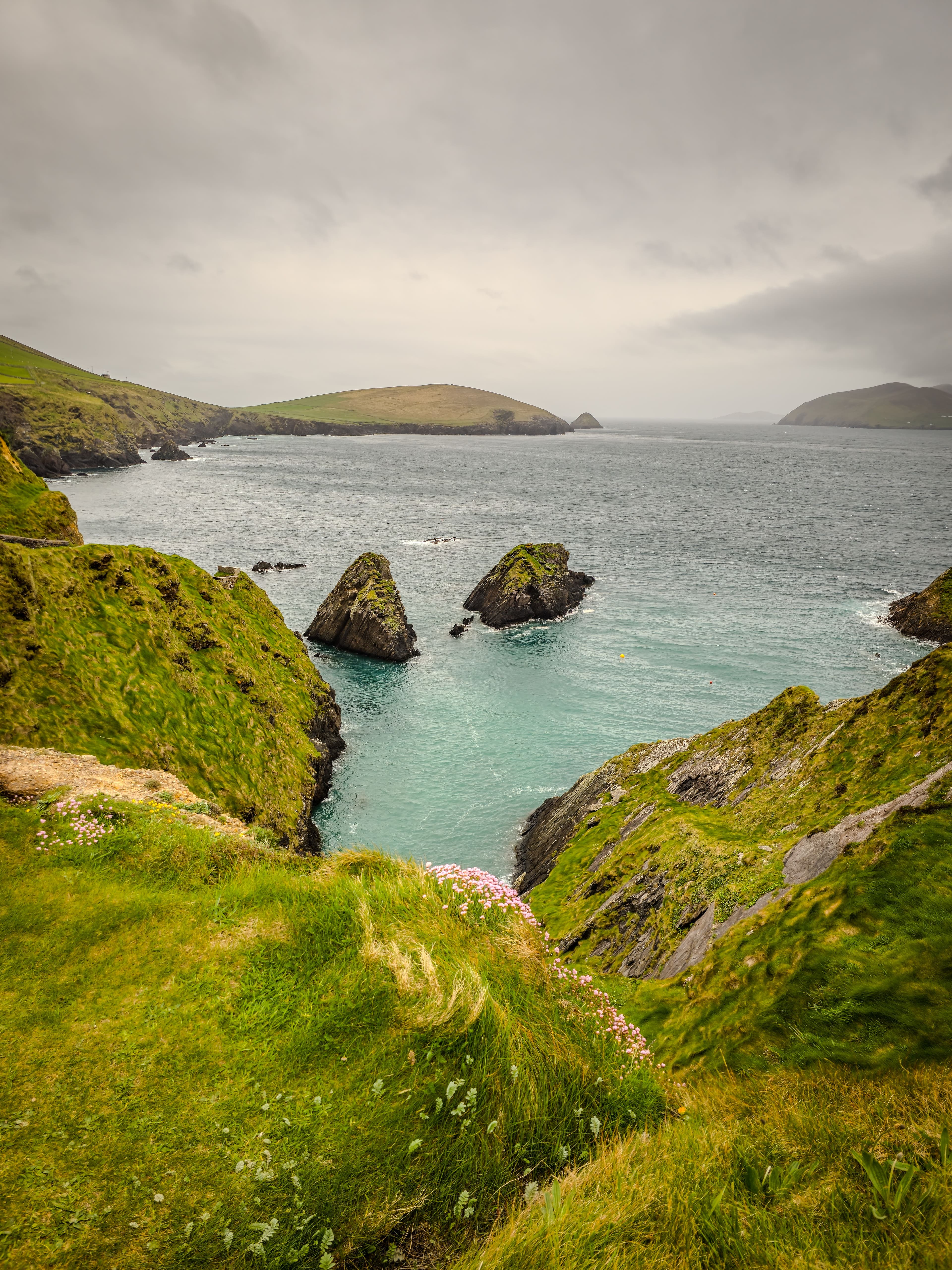 Sea stacks and a turquoise cove near Dún Chaoin on the Slea Head peninsula, a short drive west of Dingle town