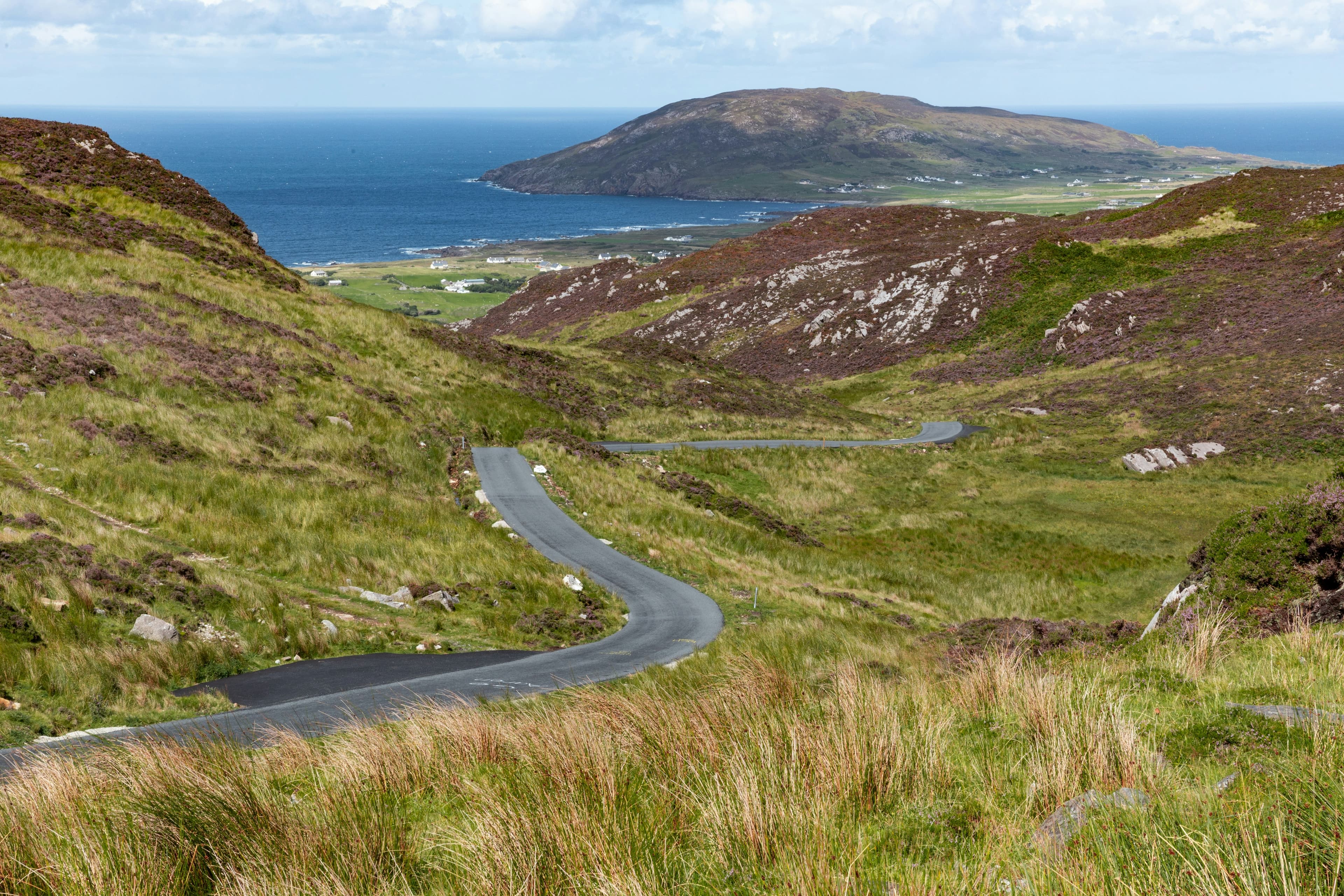 A winding coastal road through the hills of County Donegal along the Wild Atlantic Way
