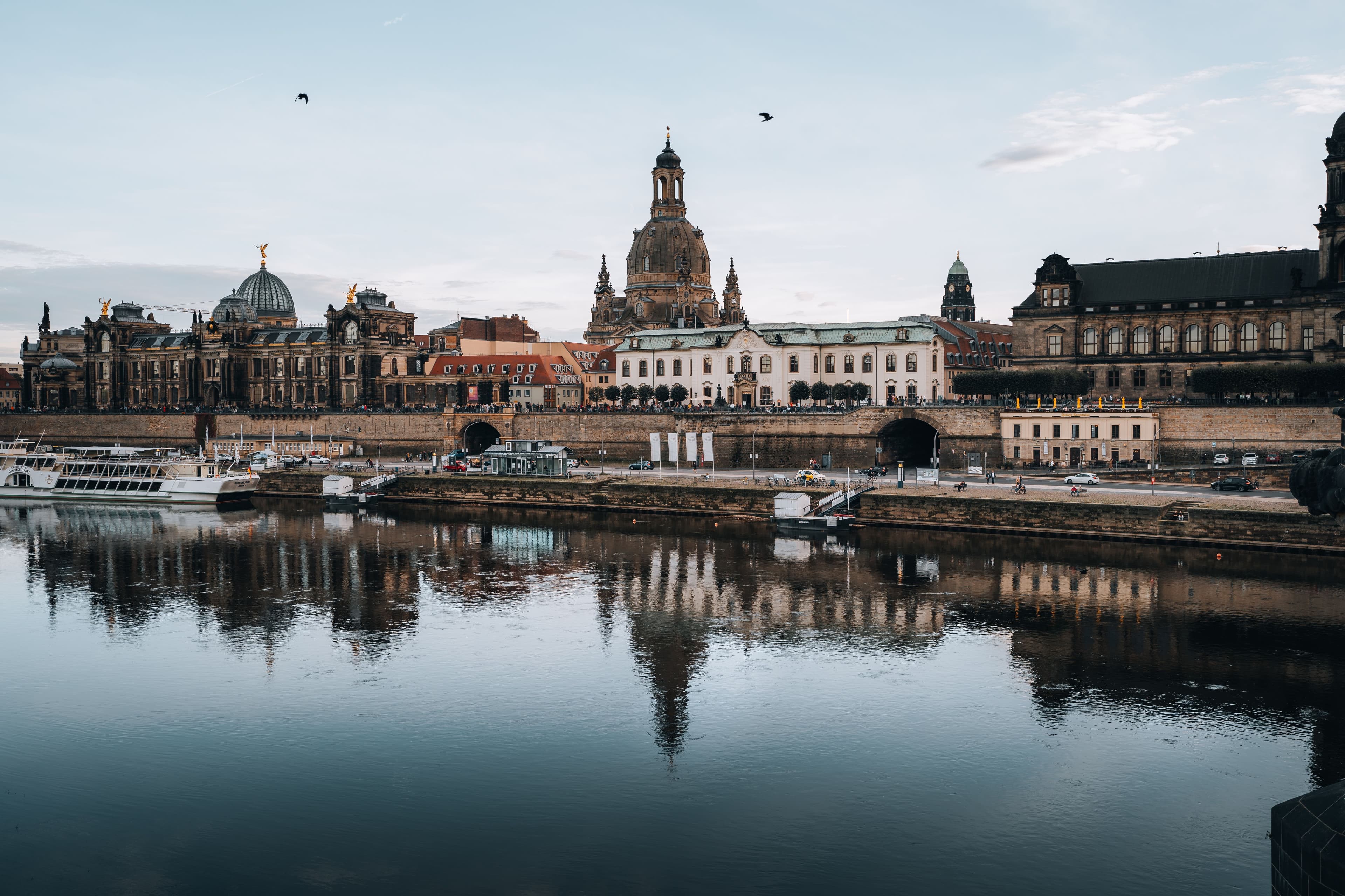 Dresden's baroque riverfront reflected in the Elbe, with the dome of the Frauenkirche, Brühl's Terrace and the Ständehaus above the embankment, the stretch the marathon returns along in its closing kilometres