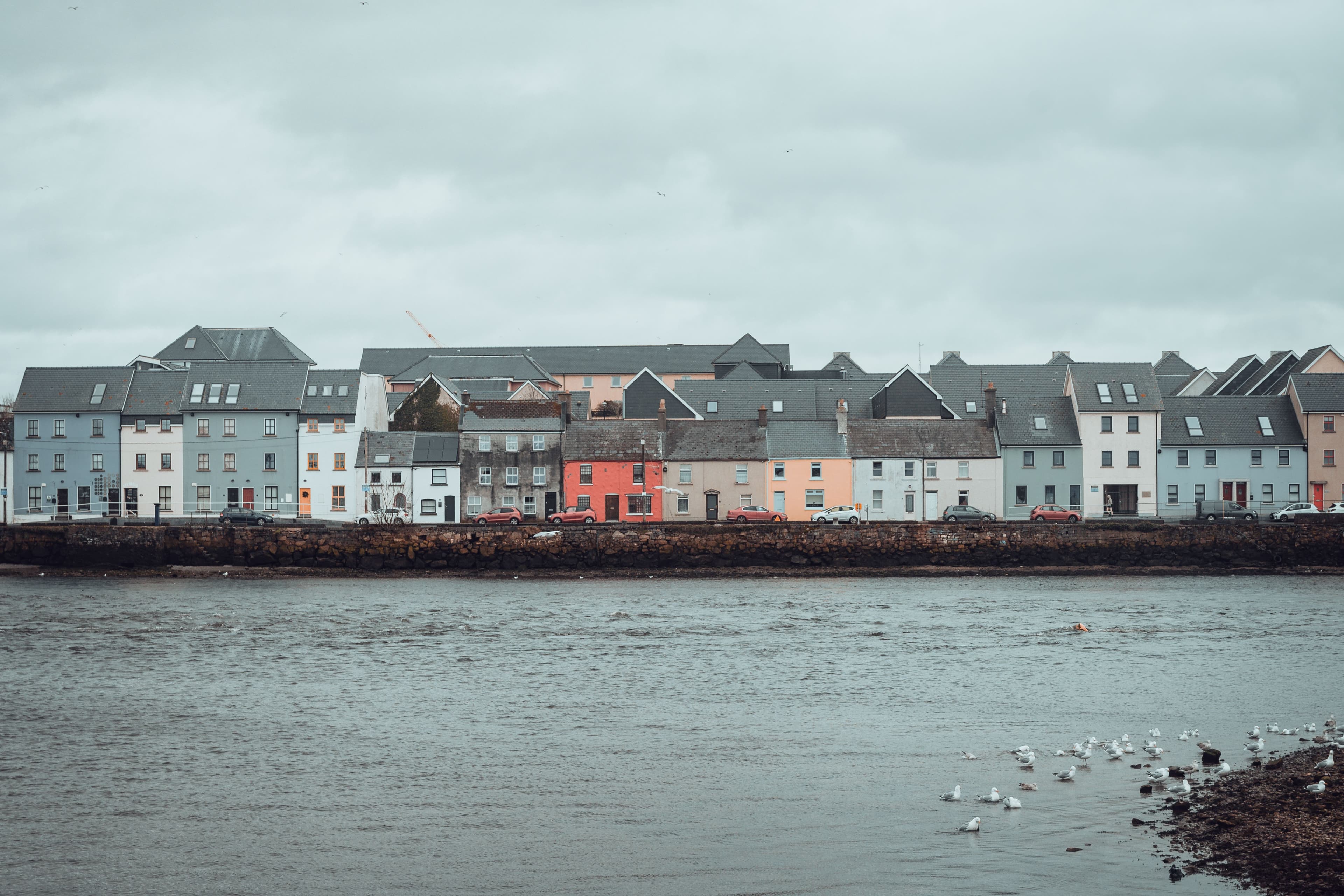 Colourful waterfront houses along Galway's Long Walk and the Claddagh, near the Galway Bay Marathon's Nimmo's Pier start and finish