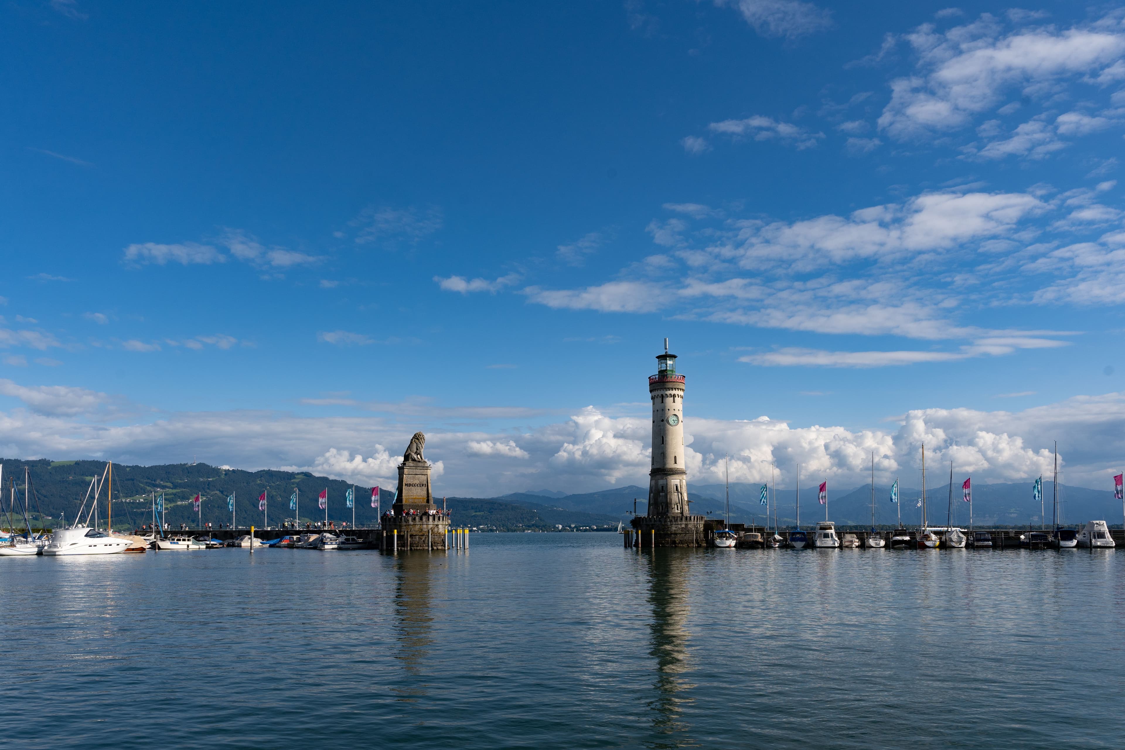 Lindau harbour entrance on Lake Constance, Germany, with its lighthouse and the Bavarian Lion statue marking the marathon's start