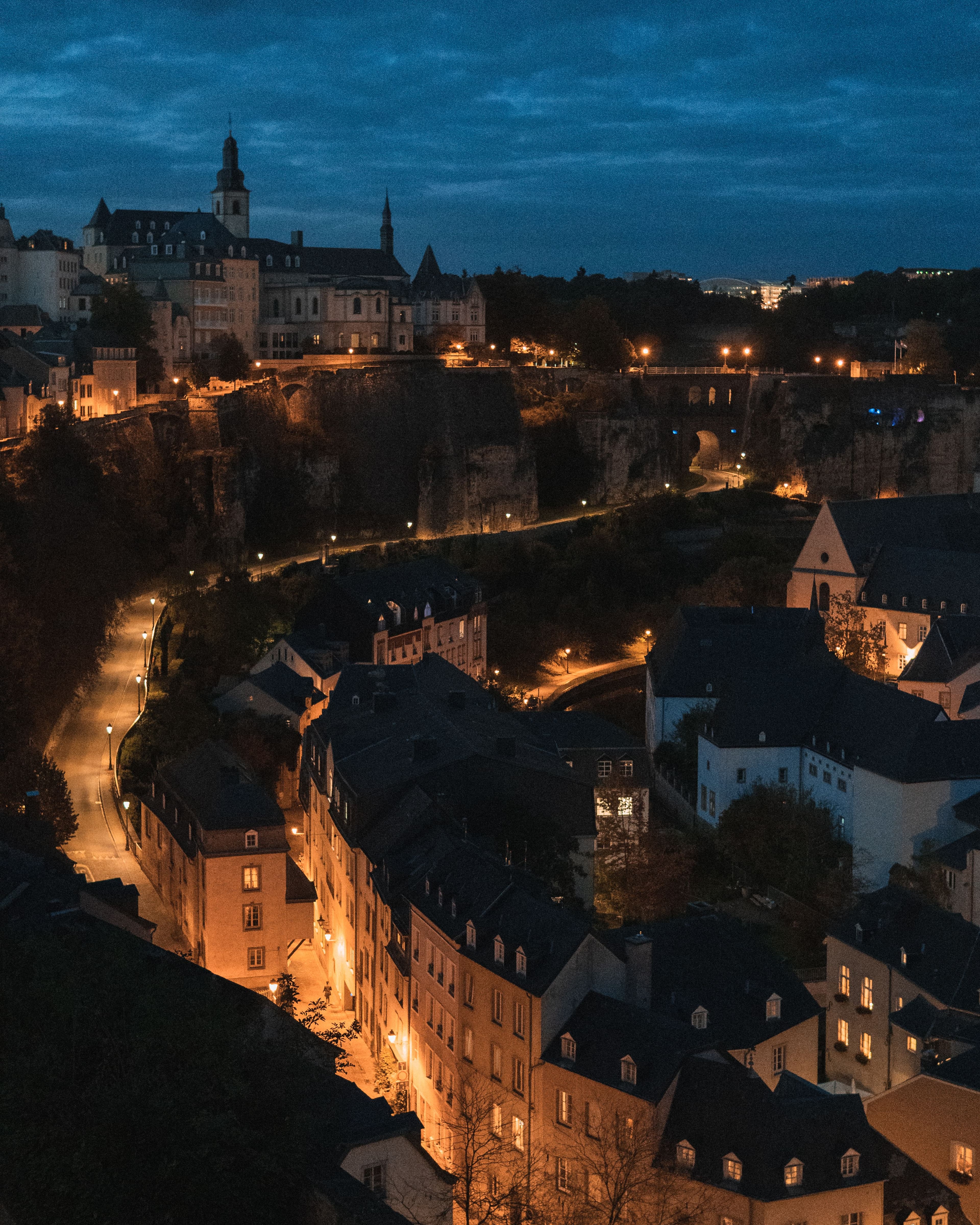 Luxembourg City's Old Town cliffside at night, overlooking the Petrusse valley the marathon route crosses