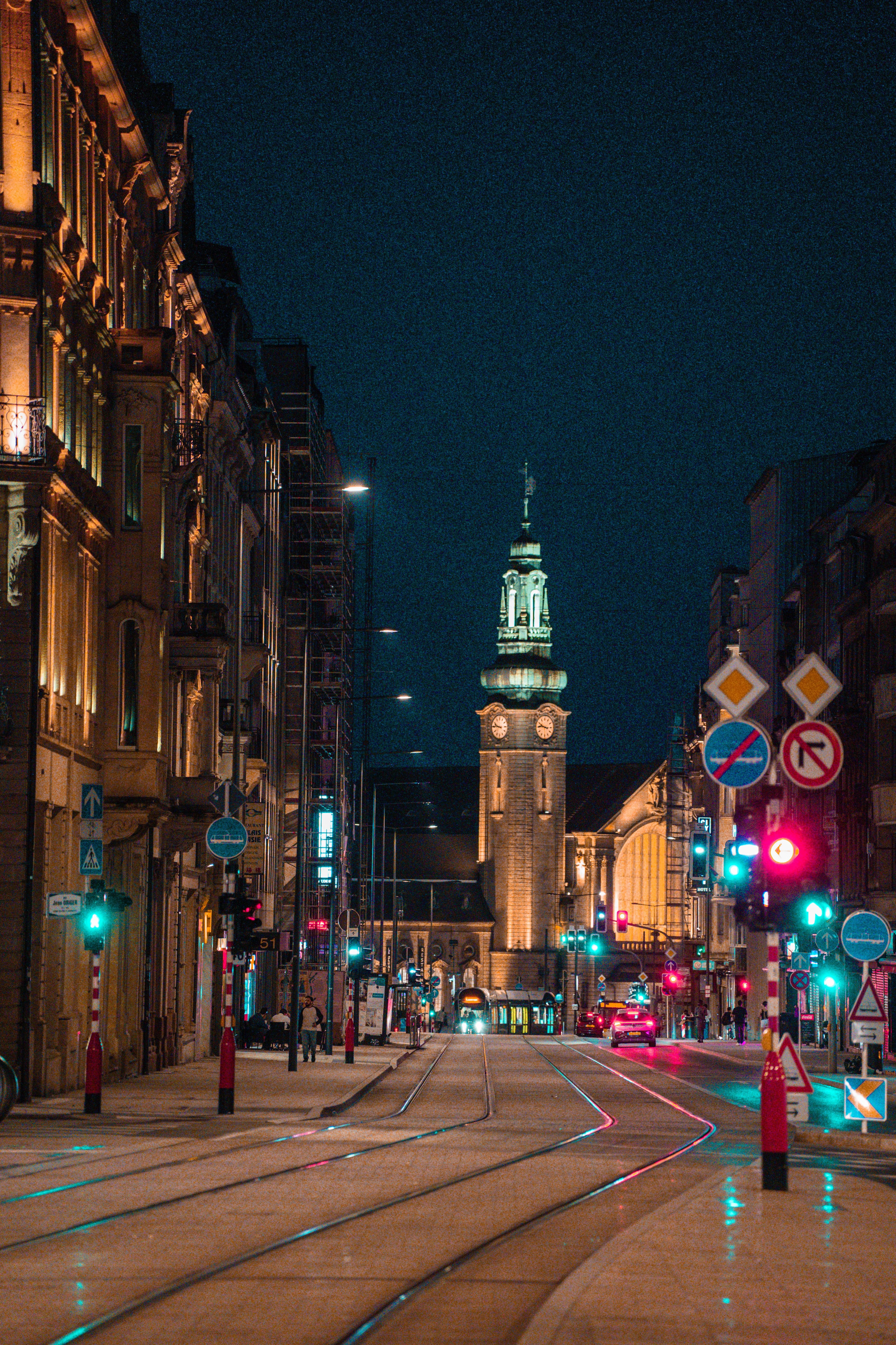 A tram-lined Luxembourg City street at night near the Gare (Station) district, on the course's route
