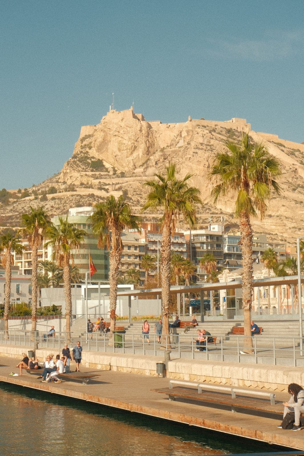 Santa Bárbara castle on Mount Benacantil above the Alicante waterfront and its palm trees, overlooking the Postiguet section the marathon reaches at km 40.4