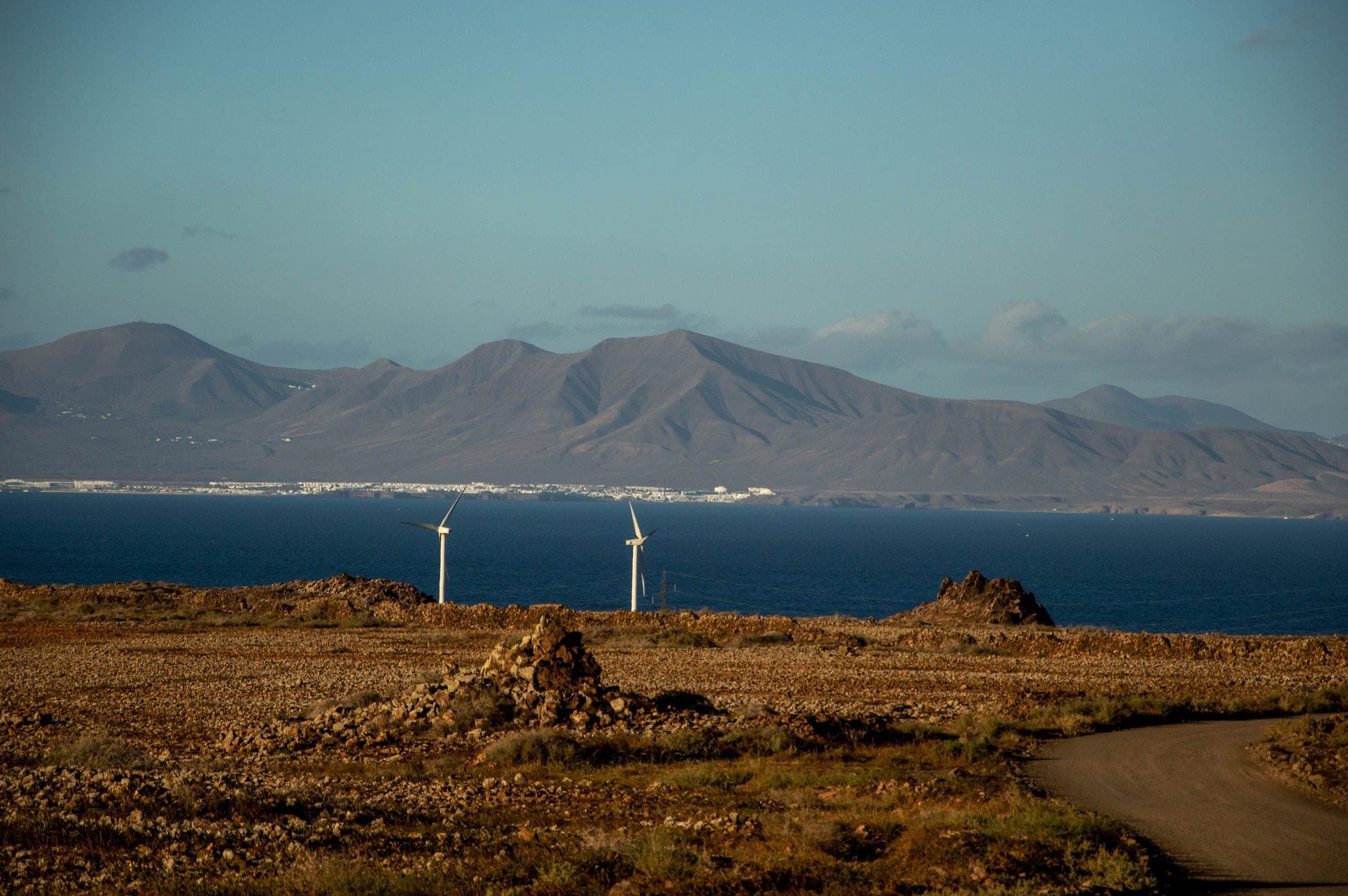 The sea off Corralejo at the northern tip of Fuerteventura, looking across the strait to the volcanic outline of Lanzarote