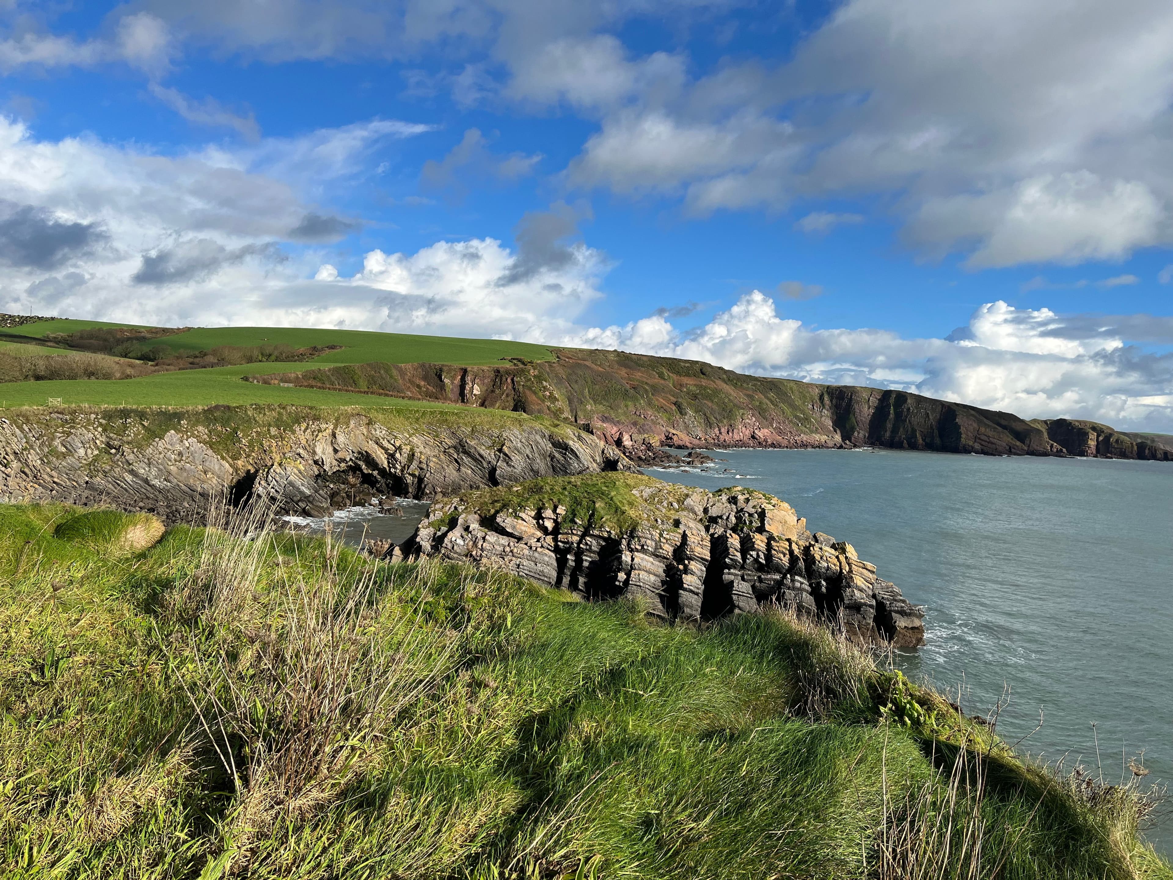 Rugged South Wales coastline near Pembrokeshire, a popular multi-day extension from the Newport Marathon rather than the flat riverside course itself