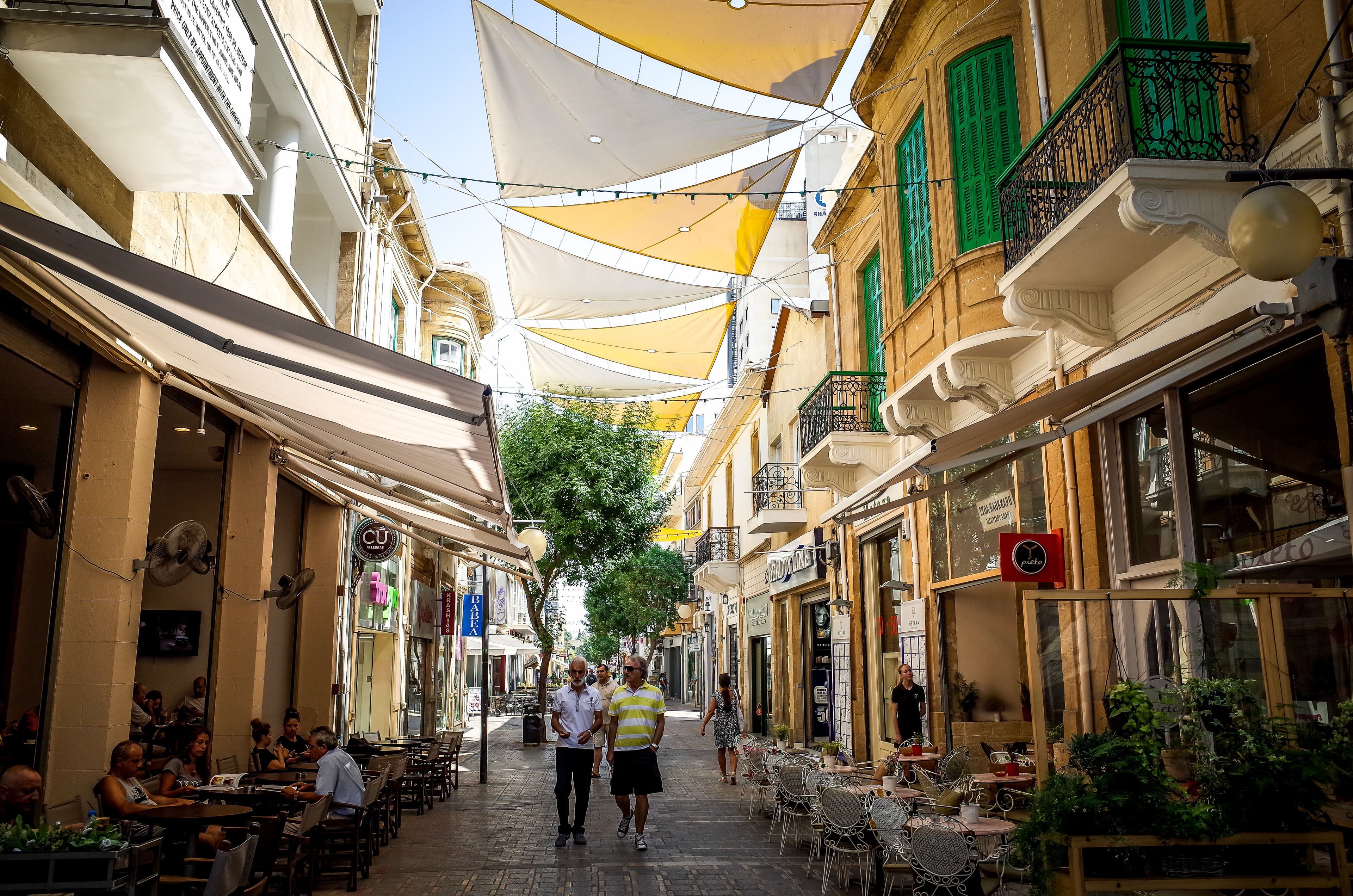 Ledra Street in Nicosia's old town, with shade sails overhead and cafe terraces along the pedestrianised street