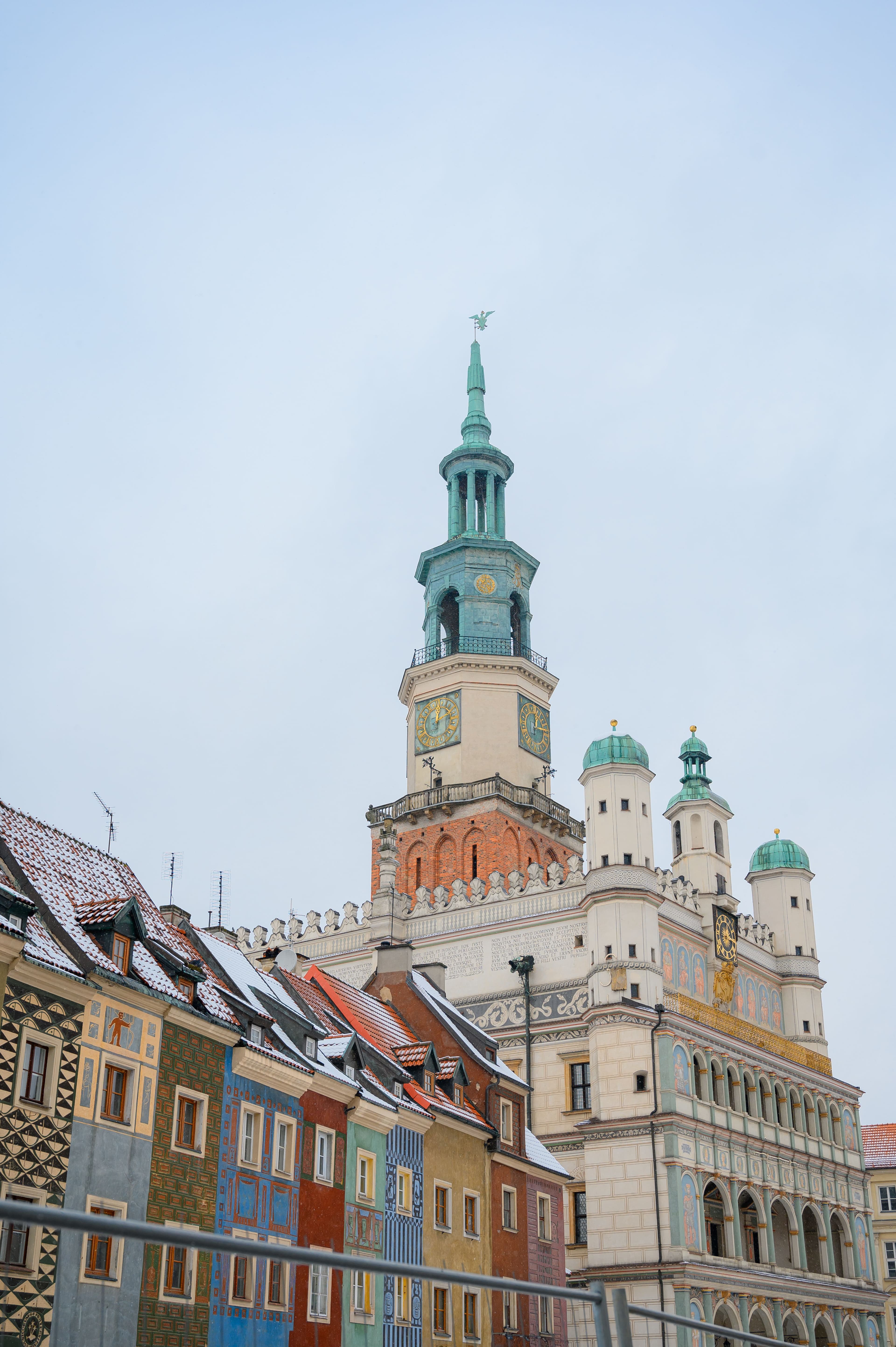 The Renaissance clock tower of Poznań's Old Town Hall rising above the colourful merchant houses of the Old Market Square