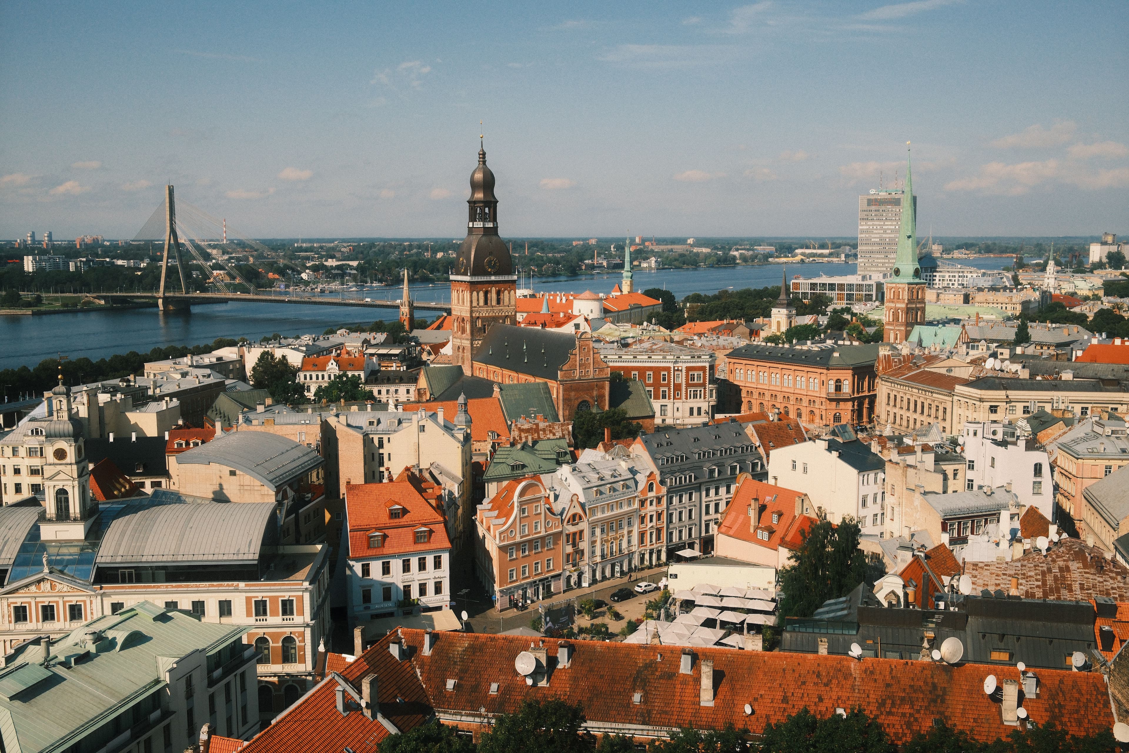 Aerial view of Riga's Old Town, with St Peter's Church tower, the Daugava river and the cable-stayed Vansu Bridge