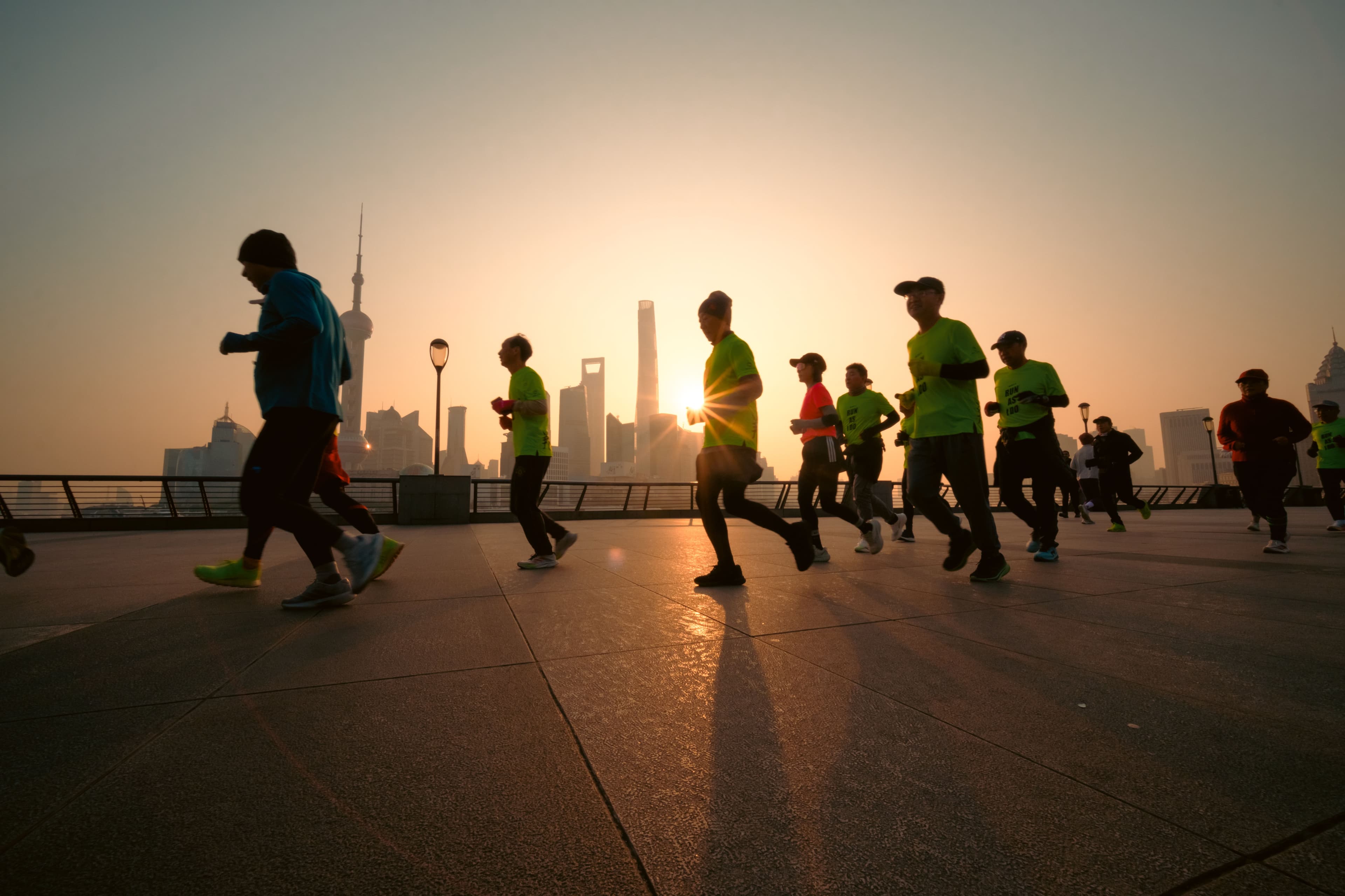 A group of runners training together on a Shanghai street, reflecting the city's fast-growing recreational running culture