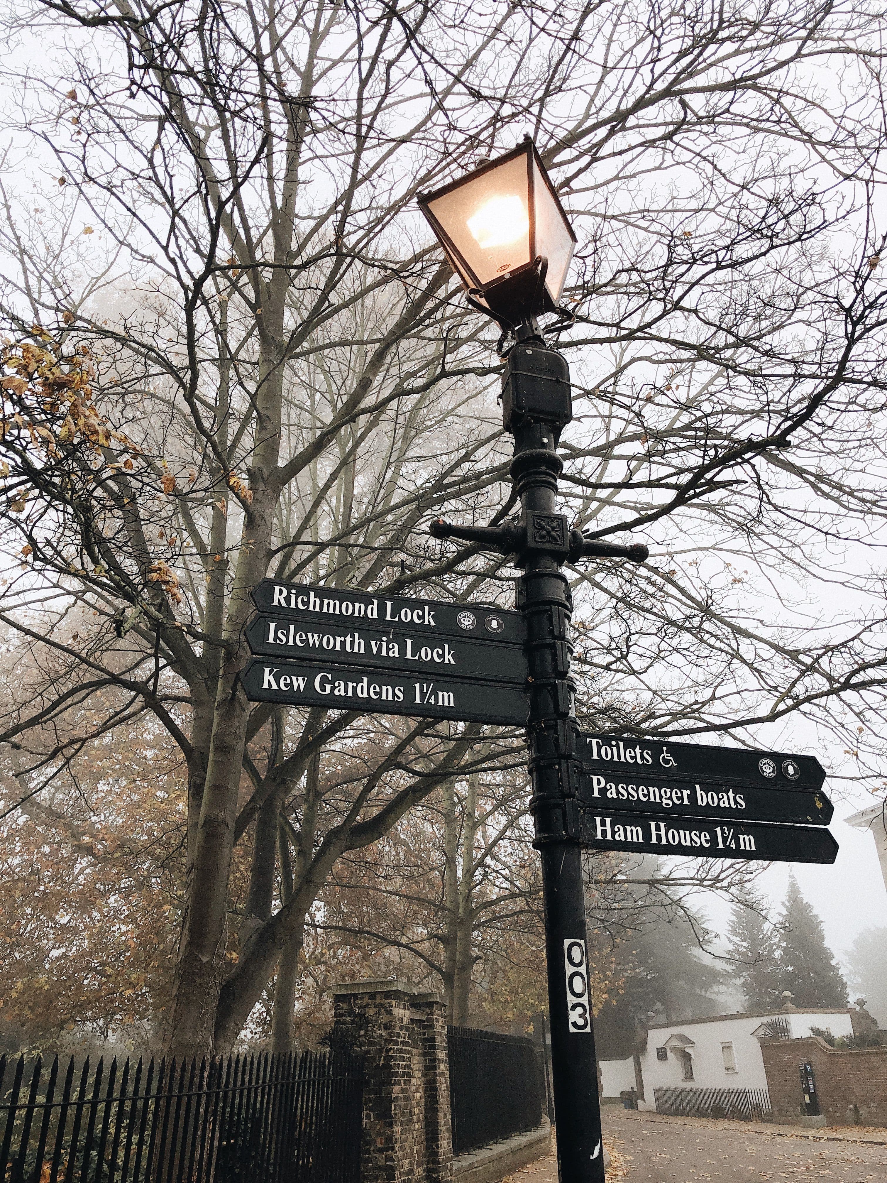 A Thames Path signpost near Richmond Lock pointing to Kew Gardens, Isleworth and Ham House, on the marathon's own route