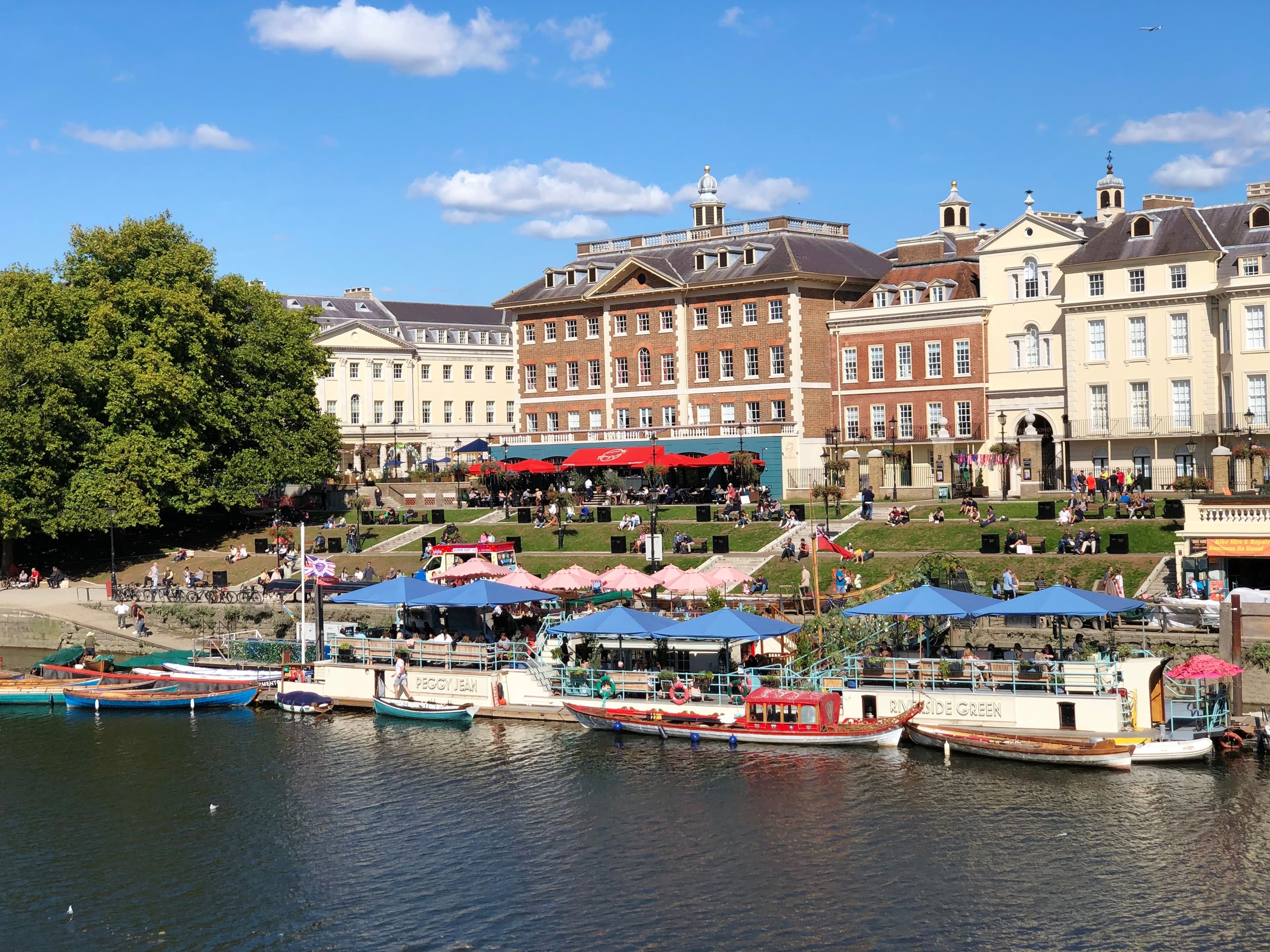 Riverside cafes, boats and Georgian terraces along the Thames at Richmond, part of the Thames Meander Marathon's out-and-back route between Barnes and Petersham
