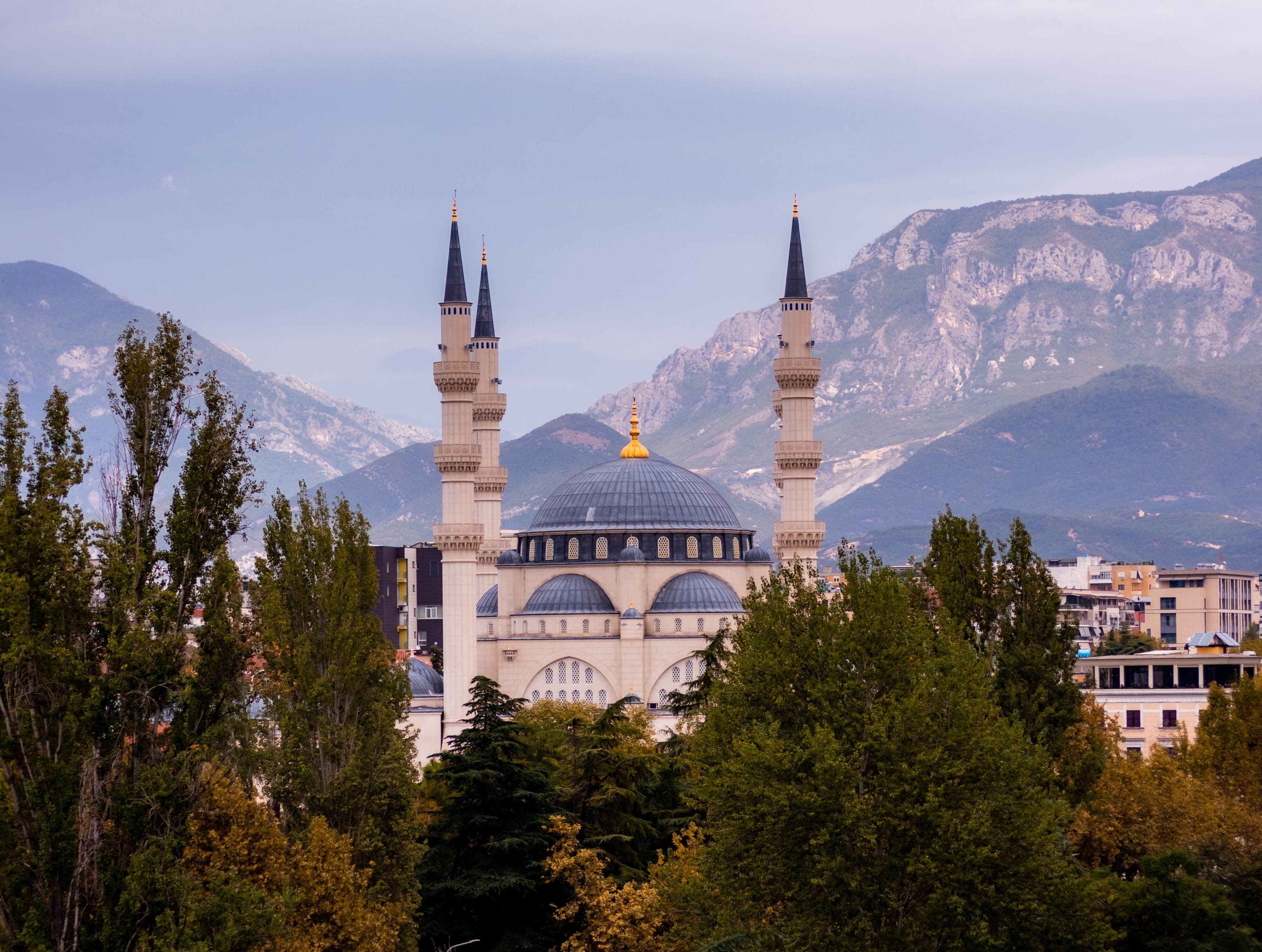 The Namazgah Mosque in Tirana with the Albanian mountains behind, seen from within the city