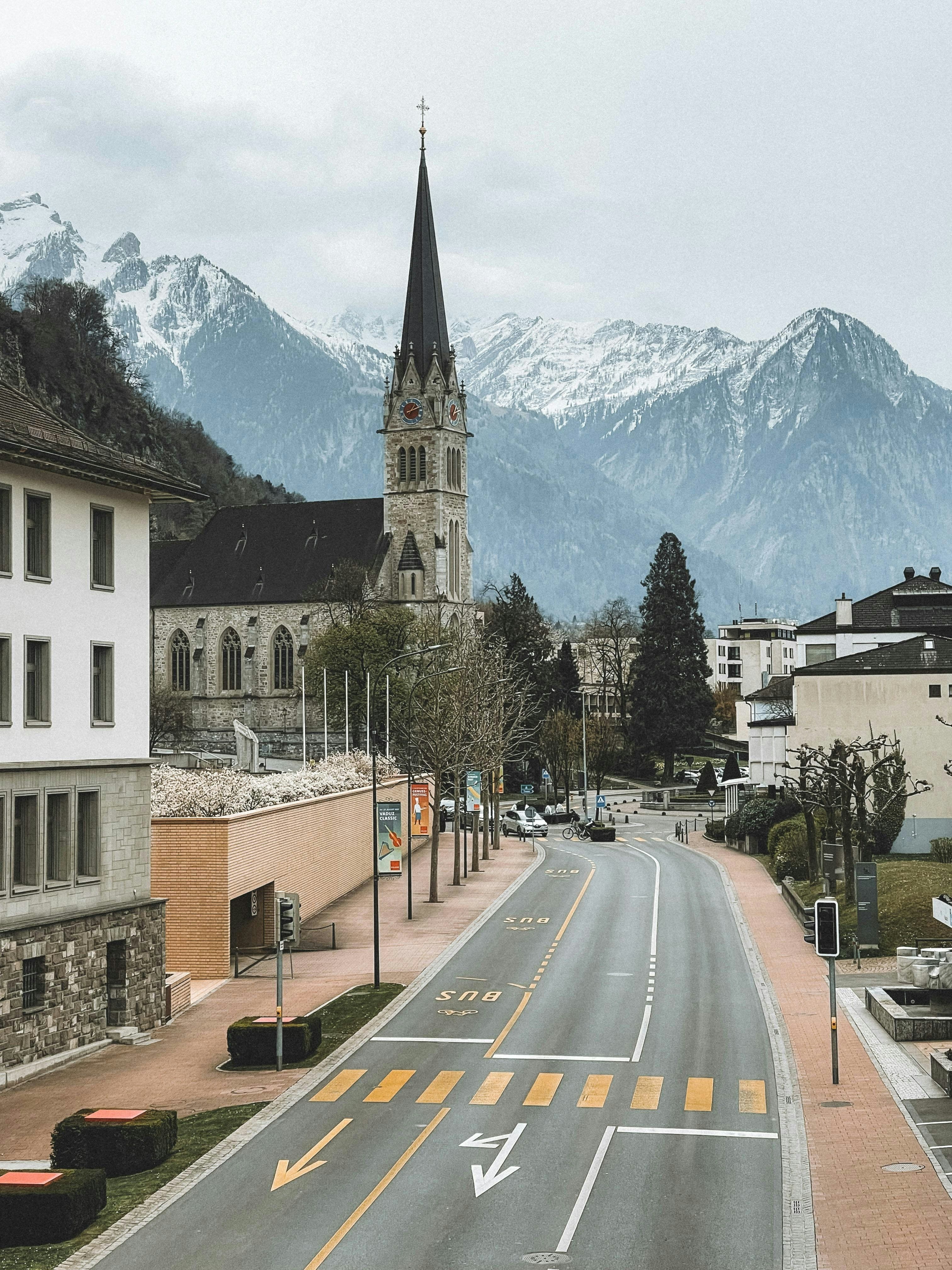 Vaduz Cathedral with the snow-capped Alps behind, in central Vaduz on the marathon course