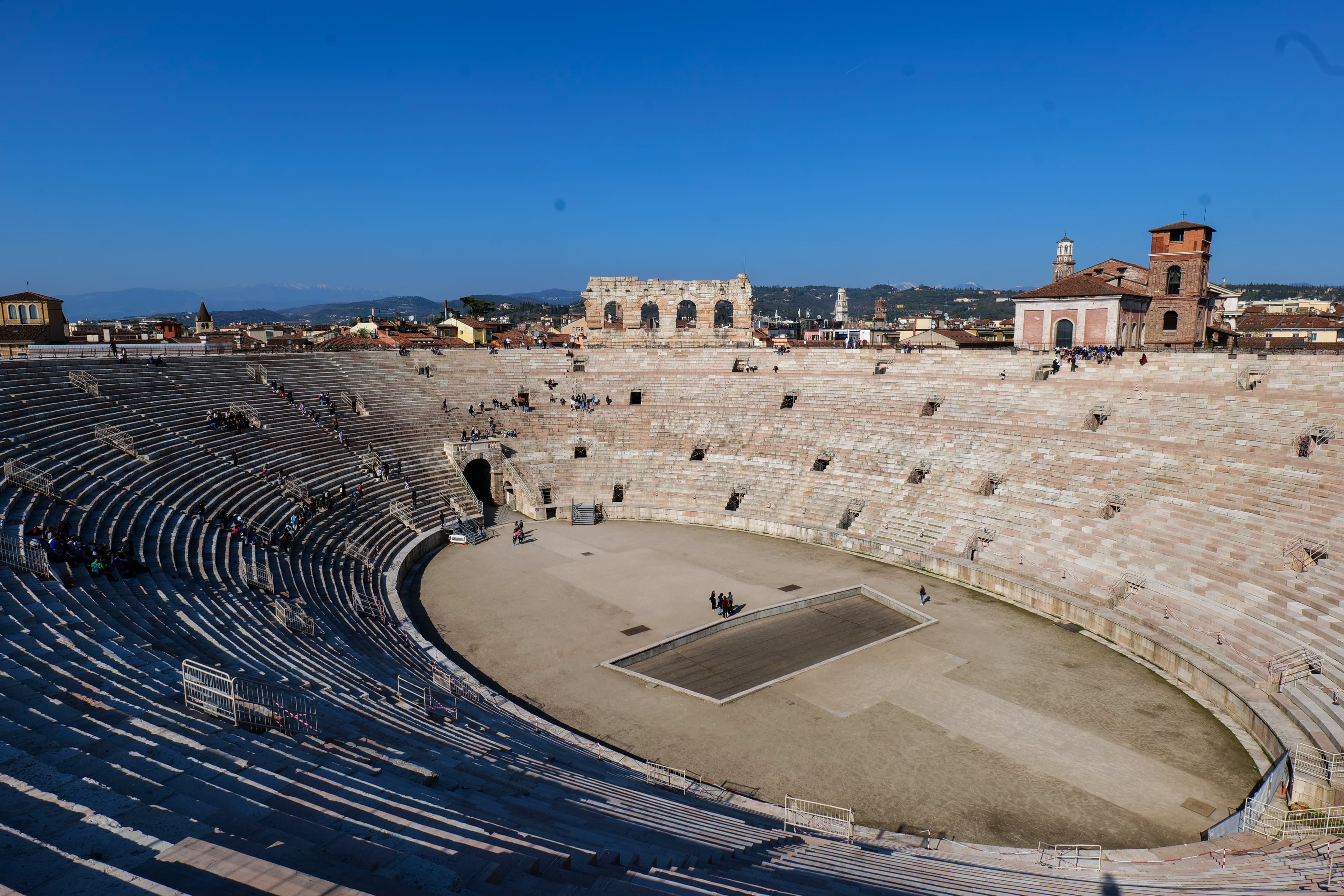 The Roman Arena in Verona's Piazza Bra, the ancient amphitheatre rising above the piazza in early spring light