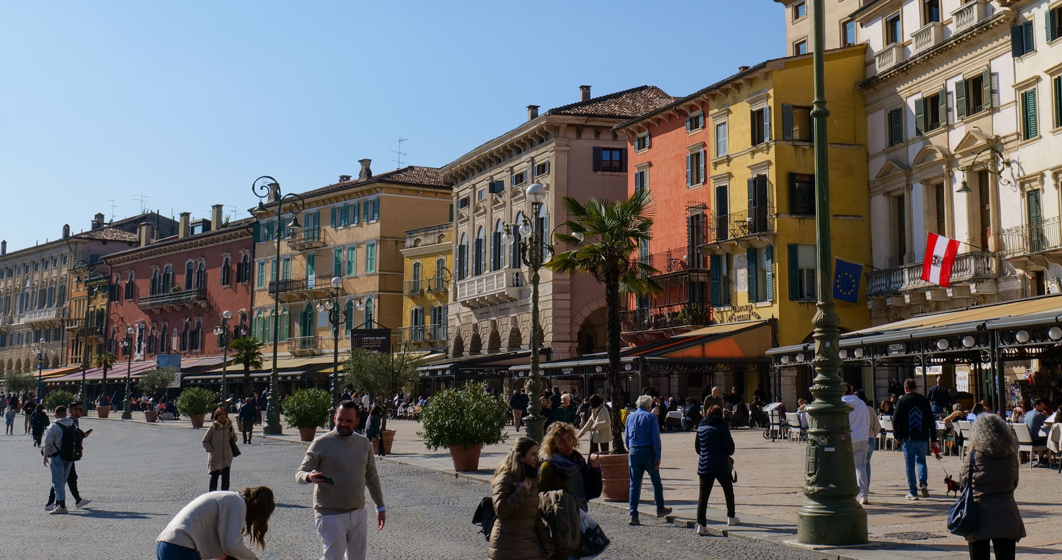 The medieval streets and terracotta rooftops of Verona's historic centre, with the Adige river bend visible below