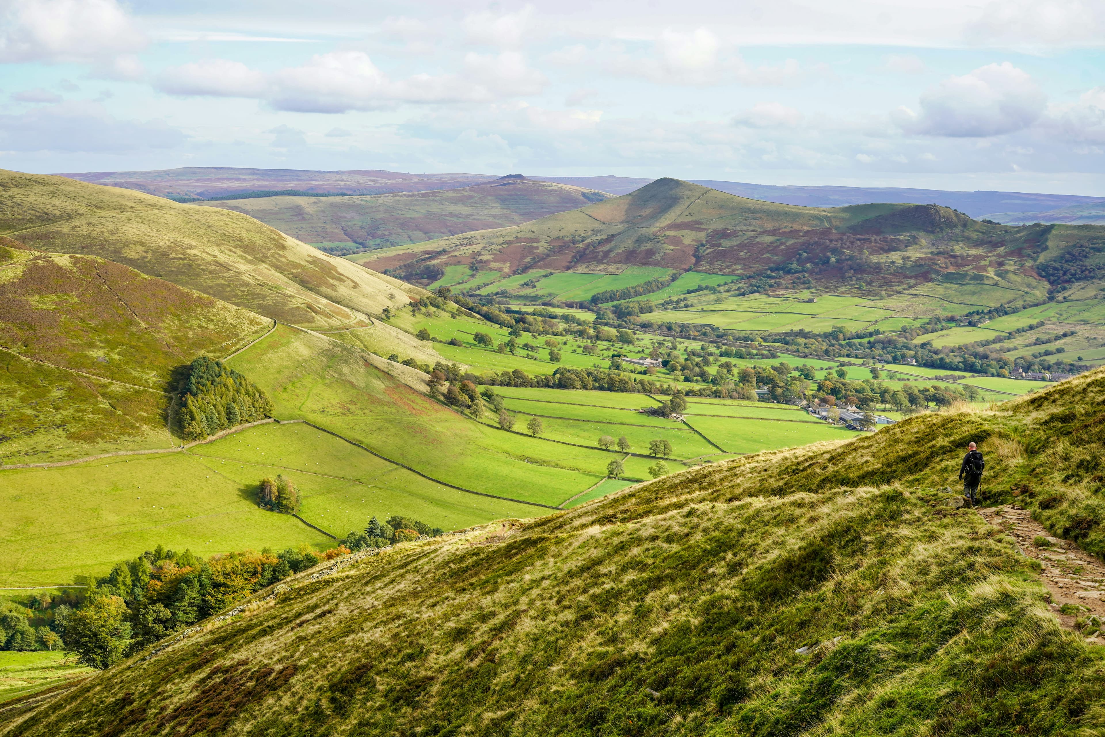 Rolling green hills in the Peak District, the wider landscape the White Peak Marathon's former-railway-trail course runs through
