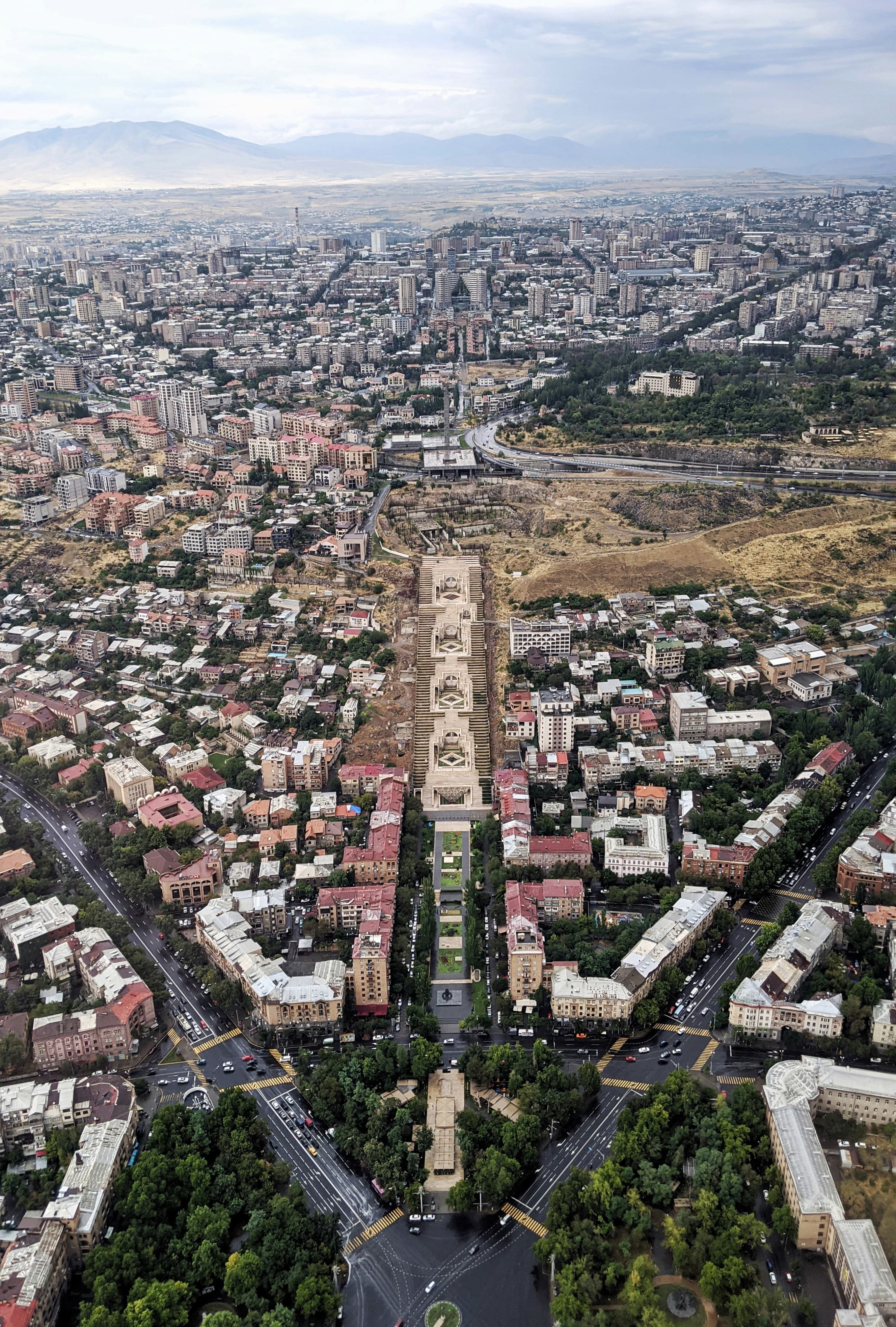 Aerial view over central Yerevan looking toward the Cascade complex and the Caucasus mountains beyond