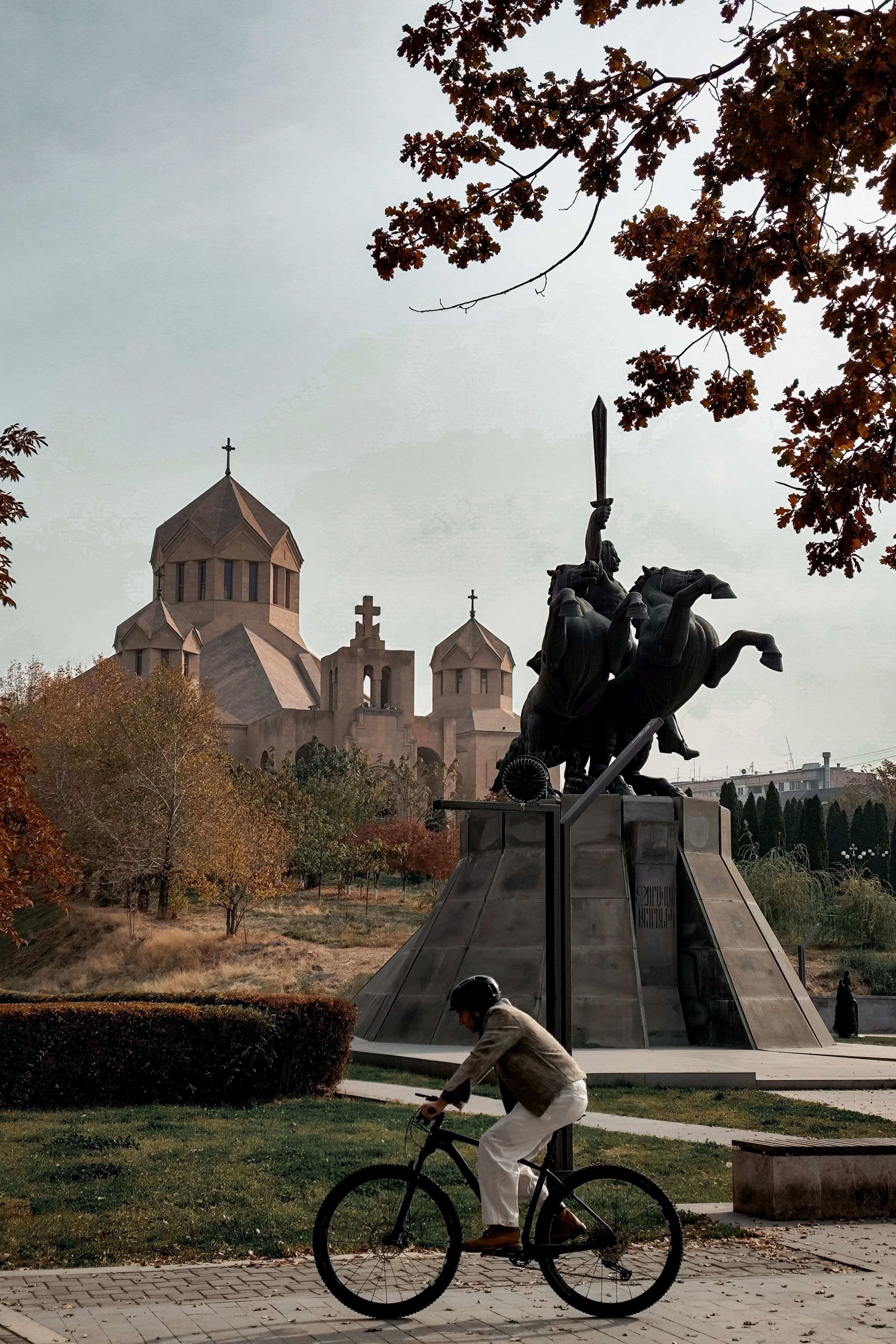 The Sasuntsi Davit equestrian statue with the domes of Surp Grigor Lusavorich Cathedral behind, central Yerevan