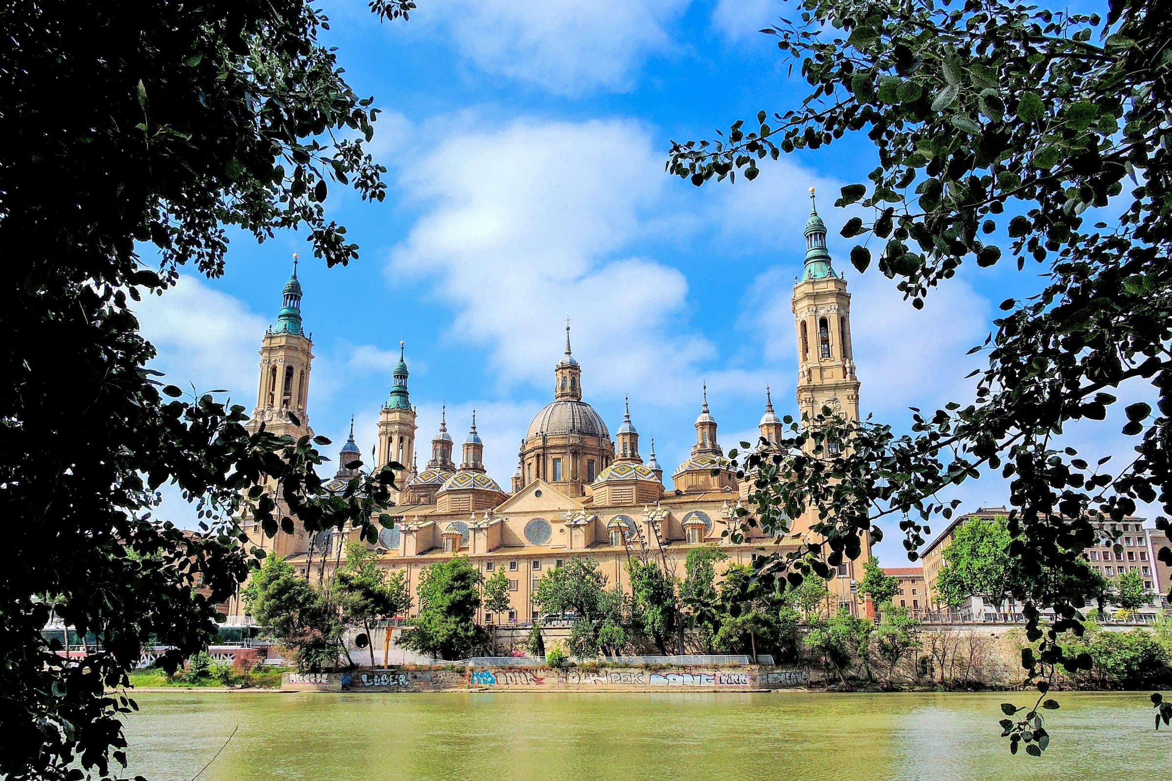 The Basilica of Our Lady of the Pillar and its towers seen across the Ebro in Zaragoza, above Plaza del Pilar where the marathon starts and finishes