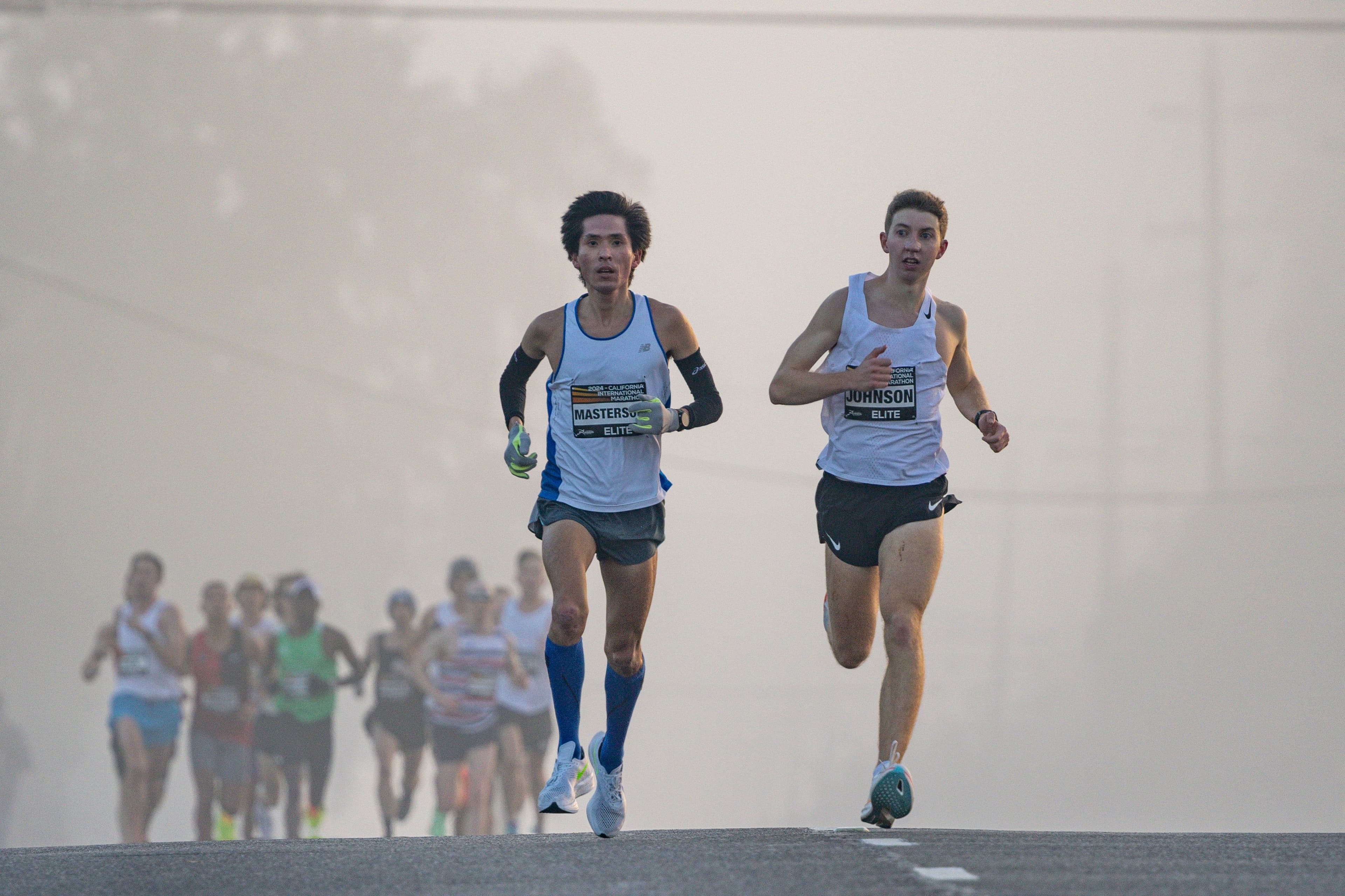A data visualisation showing marathon finishing time distributions across elite and mass-participation race fields